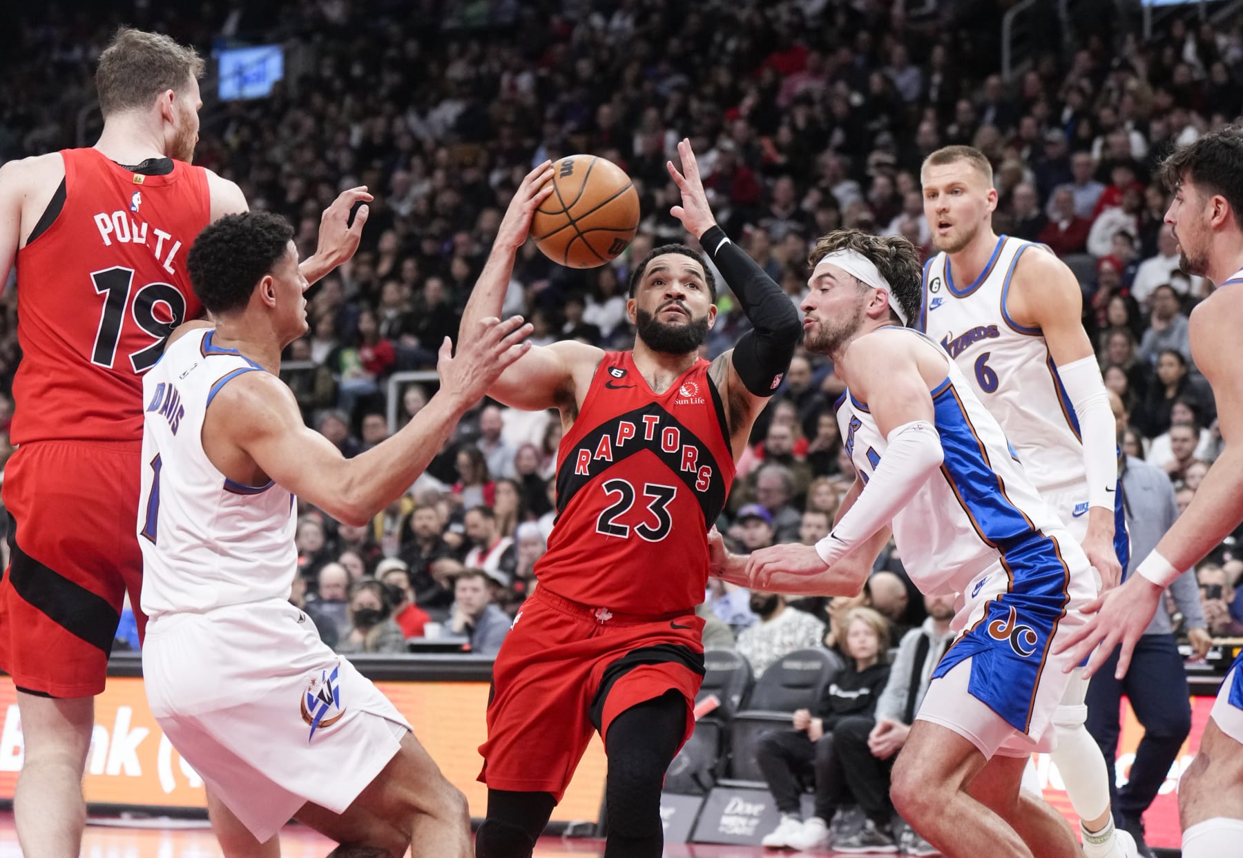TORONTO, ON - MARCH 26: Fred VanVleet #23 of the Toronto Raptors drives against Johnny Davis #1 of the Washington Wizards during the first half of their basketball game at the Scotiabank Arena on March 26, 2023 in Toronto, Ontario, Canada. NOTE TO USER: User expressly acknowledges and agrees that, by downloading and/or using this Photograph, user is consenting to the terms and conditions of the Getty Images License Agreement. (Photo by Mark Blinch/Getty Images)