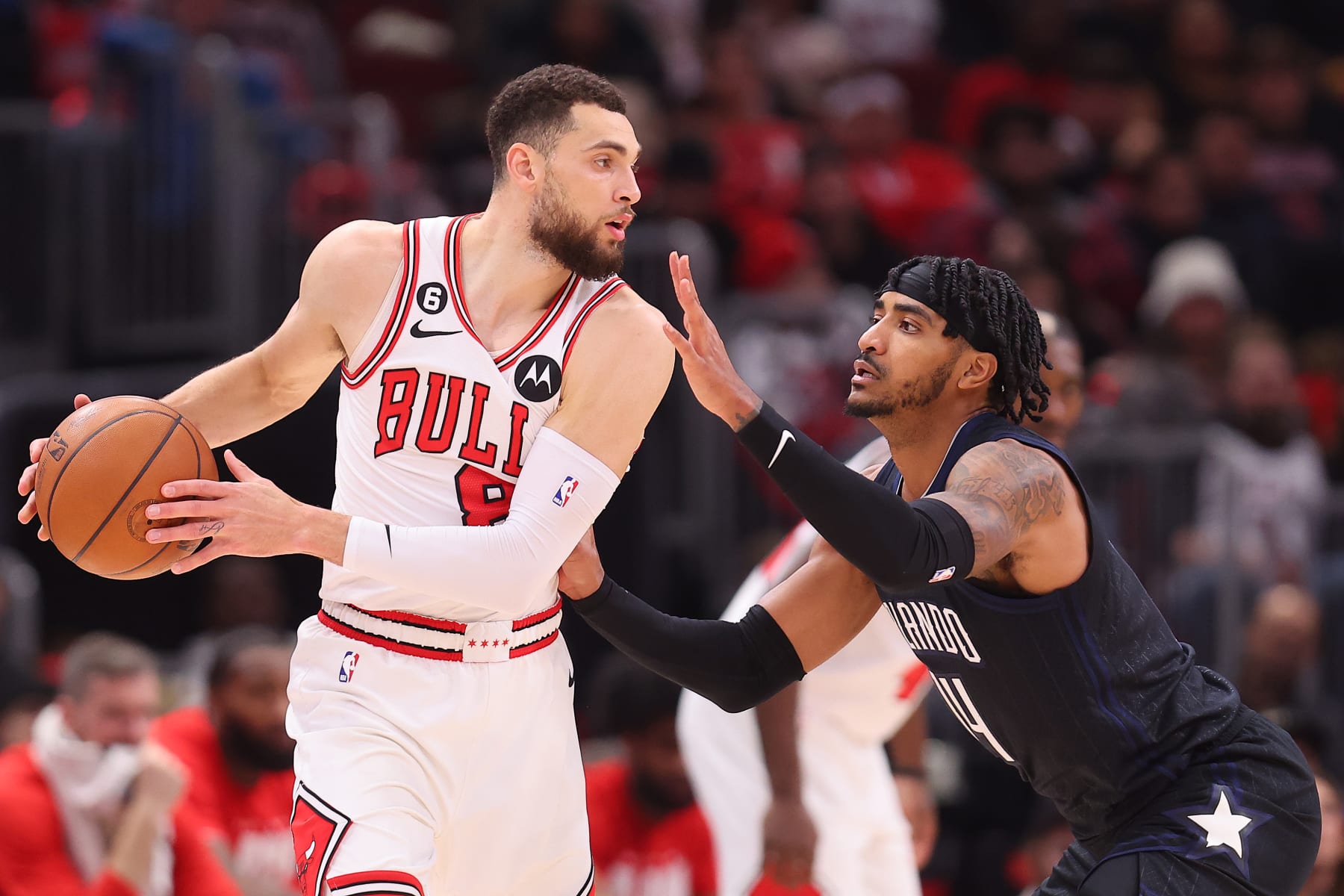 CHICAGO, ILLINOIS - FEBRUARY 13: Zach LaVine #8 of the Chicago Bulls is defended by Gary Harris #14 of the Orlando Magic during the first half at United Center on February 13, 2023 in Chicago, Illinois. NOTE TO USER: User expressly acknowledges and agrees that, by downloading and or using this photograph, User is consenting to the terms and conditions of the Getty Images License Agreement.  (Photo by Michael Reaves/Getty Images)