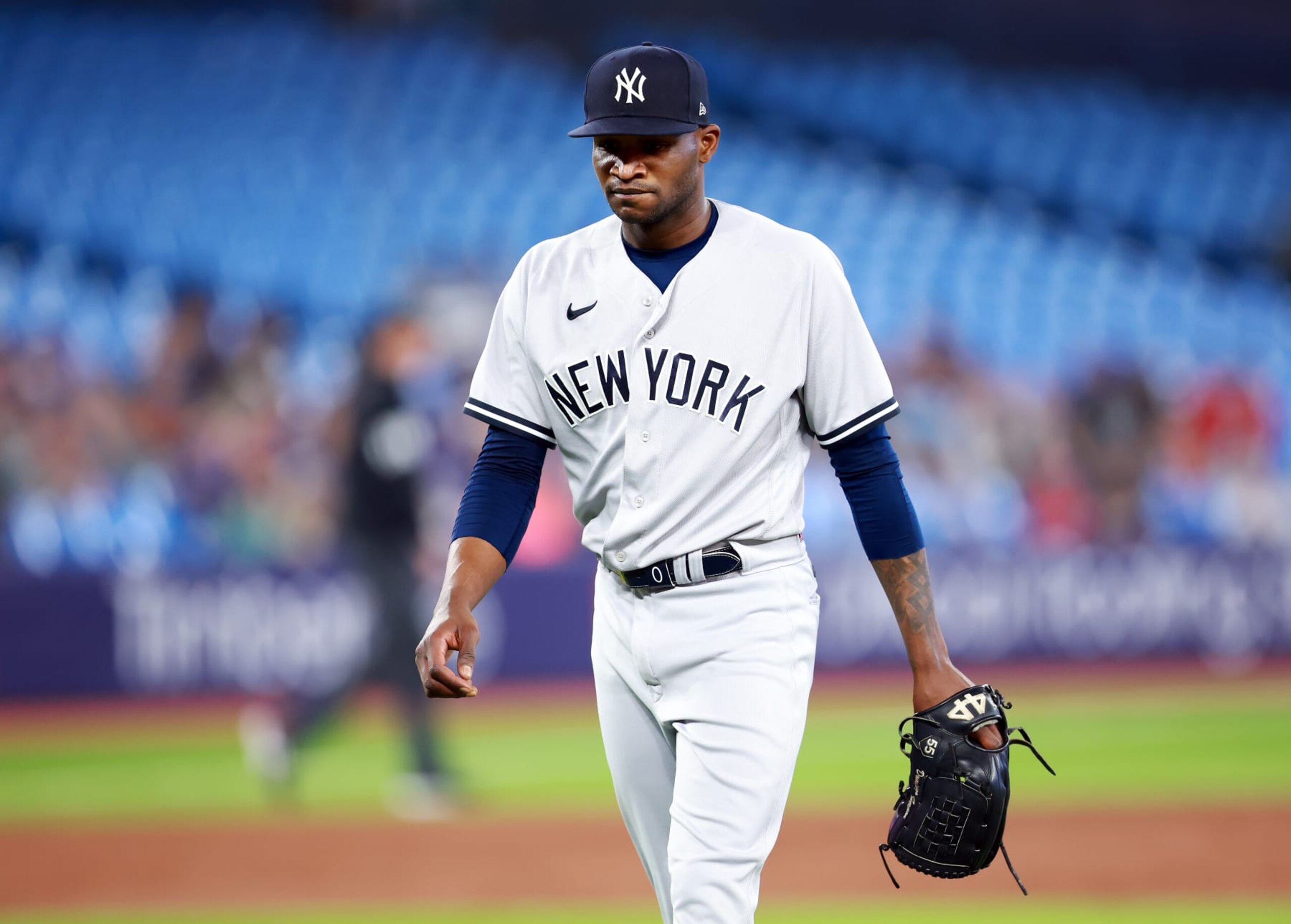 TORONTO, ON - MAY 16:  Domingo German #0 of the New York Yankees walks to the dugout in the second inning against the Toronto Blue Jays at Rogers Centre on May 16, 2023 in Toronto, Ontario, Canada.  (Photo by Vaughn Ridley/Getty Images)