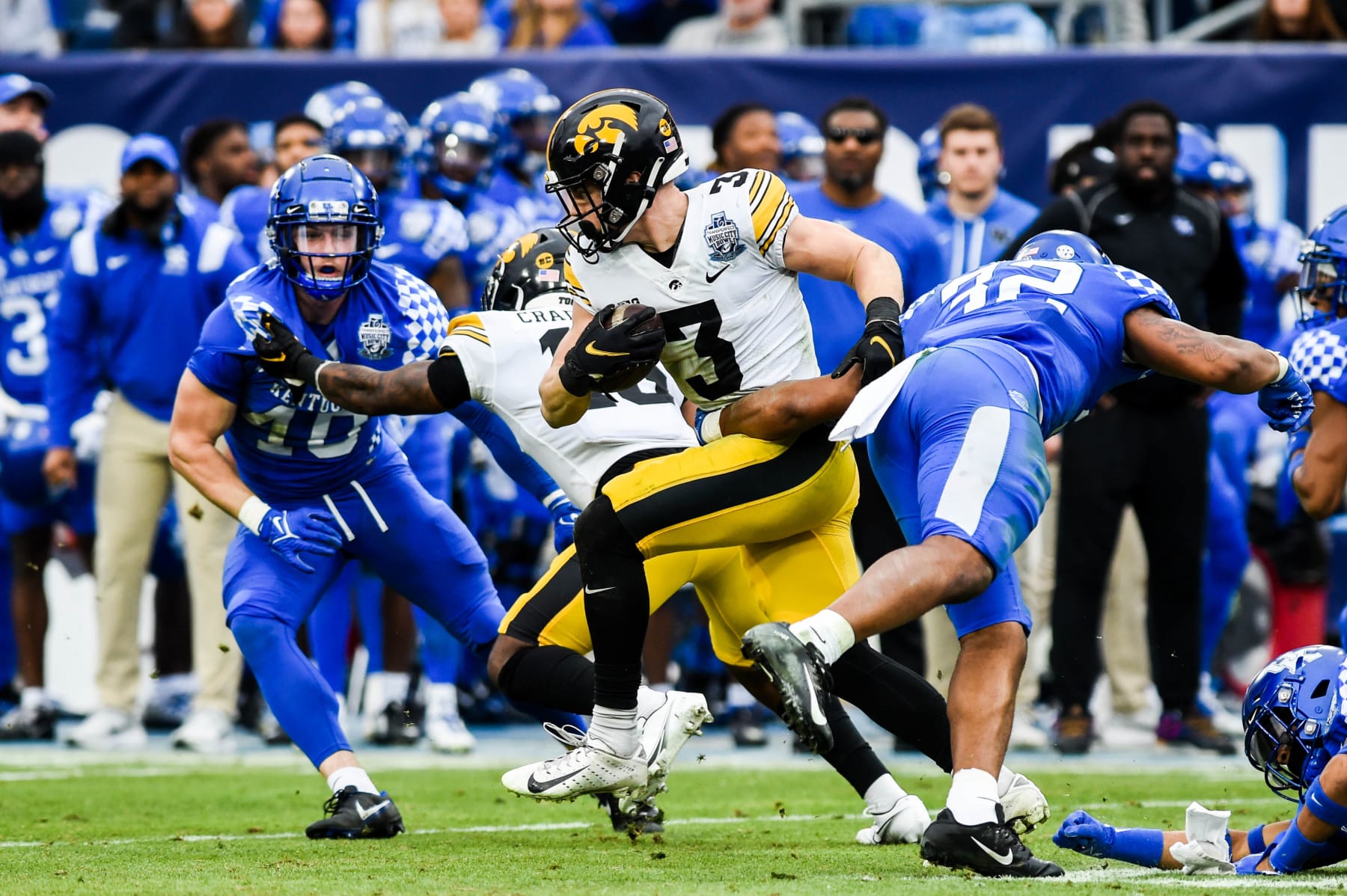 NASHVILLE, TENNESSEE - DECEMBER 31:  Cooper DeJean #3 of the Iowa Hawkeyes runs the ball against the Kentucky Wildcats during the TransPerfect Music City Bowl at Nissan Stadium on December 31, 2022 in Nashville, Tennessee.(Photo by Carly Mackler/Getty Images)