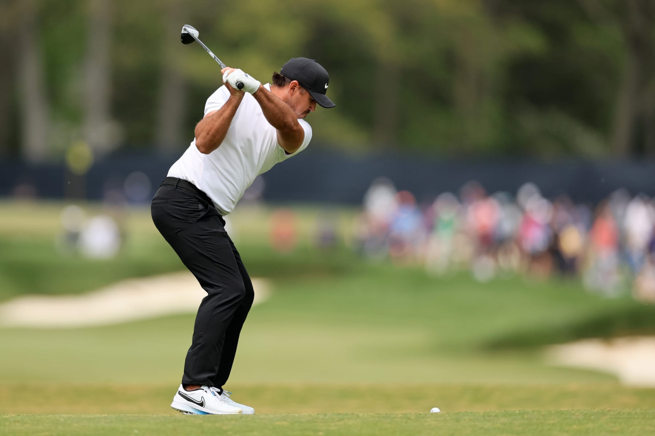 ROCHESTER, NEW YORK - MAY 16: Brooks Koepka of the United States plays an approach on the fourth hole during a practice round prior to the 2023 PGA Championship at Oak Hill Country Club on May 16, 2023 in Rochester, New York. (Photo by Andy Lyons/Getty Images)