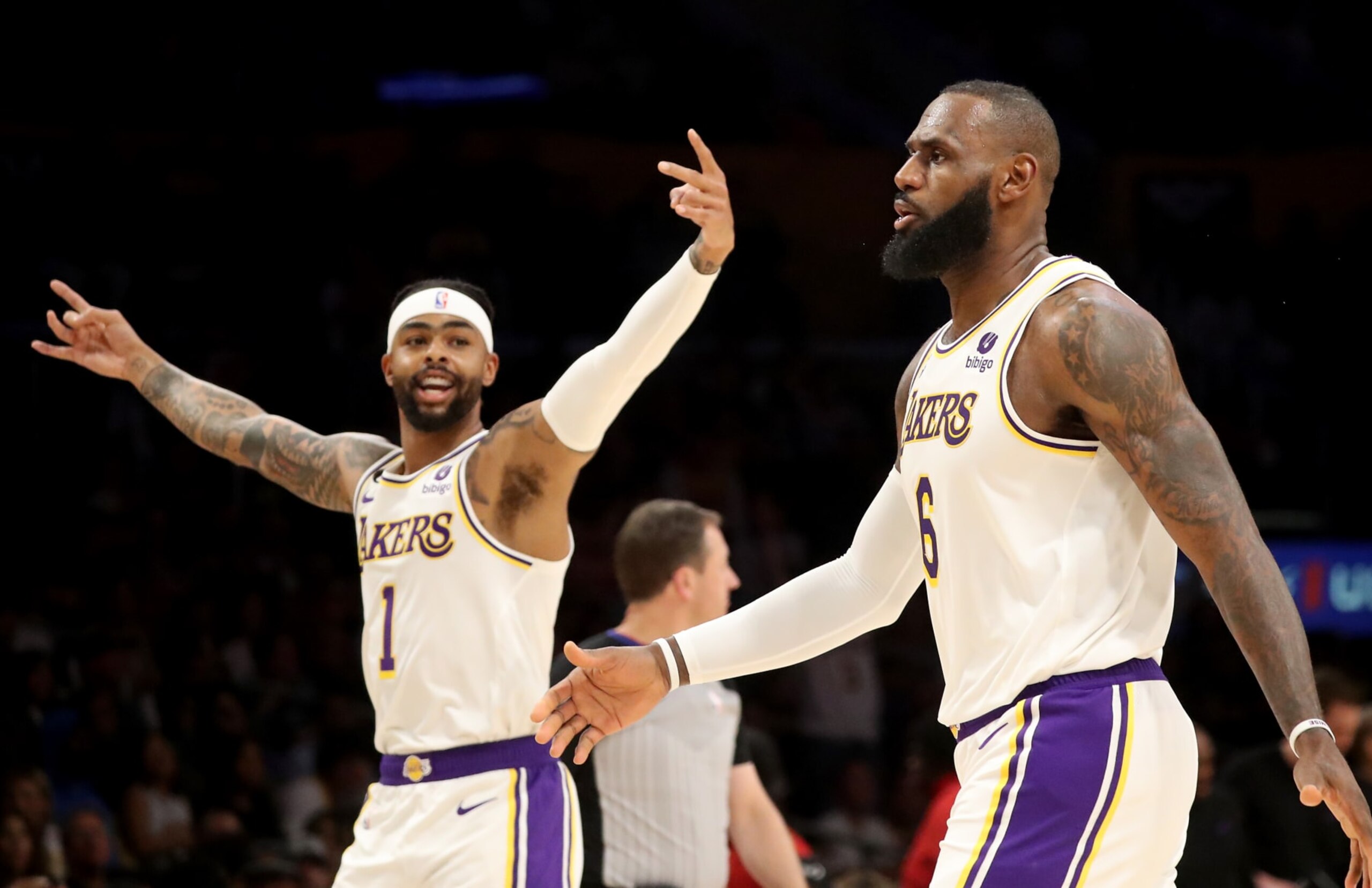 Los Angeles, CA - April 09: Lakers guard D'Angelo Russell, left, celebrates a three-pointer by forward LeBron James against the Jazz in the first quarter at Crypto.com Arena in Los Angeles on Sunday, Apr. 9, 2023. (Luis Sinco / Los Angeles Times via Getty Images)