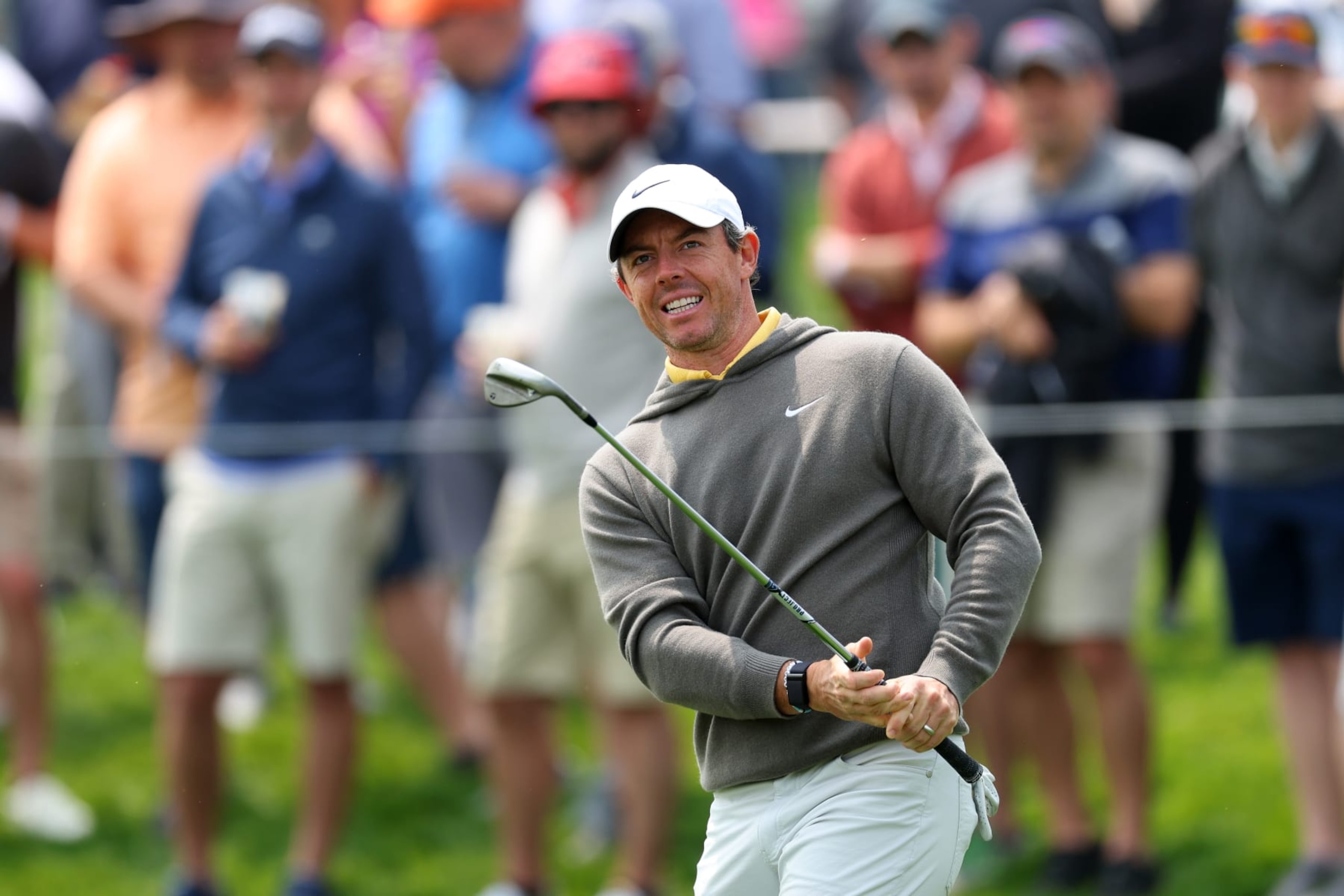 ROCHESTER, NEW YORK - MAY 16: Rory McIlroy of Northern Ireland chips to the 11th green during a practice round prior to the 2023 PGA Championship at Oak Hill Country Club on May 16, 2023 in Rochester, New York. (Photo by Andrew Redington/Getty Images)