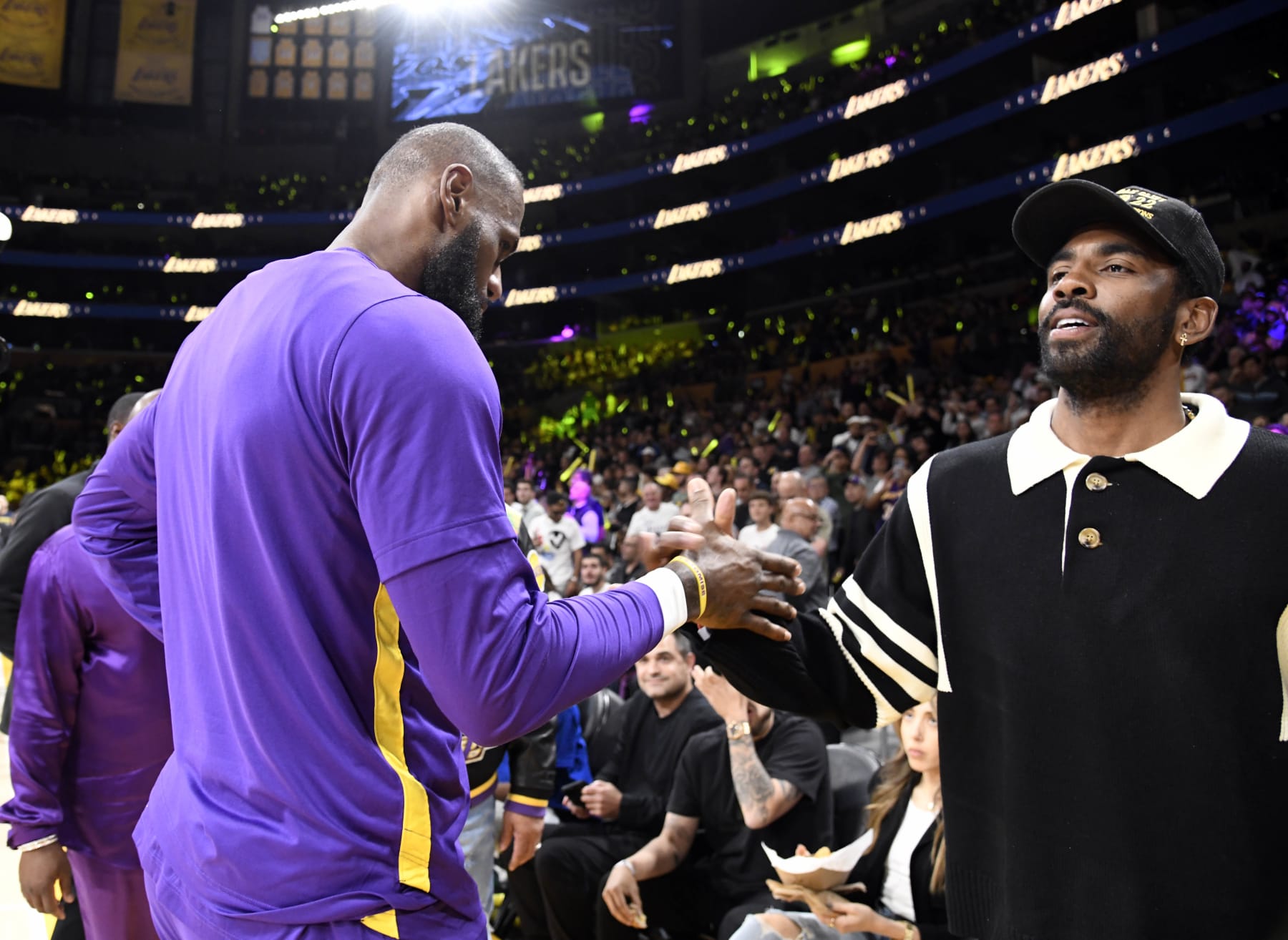 LOS ANGELES, CA - APRIL 28: Kyrie Irving #2 of the Dallas Mavericks greets LeBron James #6 of the Los Angeles Lakers as he attends a basketball game between Los Angeles Lakers and Memphis Grizzlies Round 1 Game 6 of the 2023 NBA Playoffs against Los Angeles Lakers at Crypto.com Arena on April 28, 2023 in Los Angeles, California. (Photo by Kevork Djansezian/Getty Images)