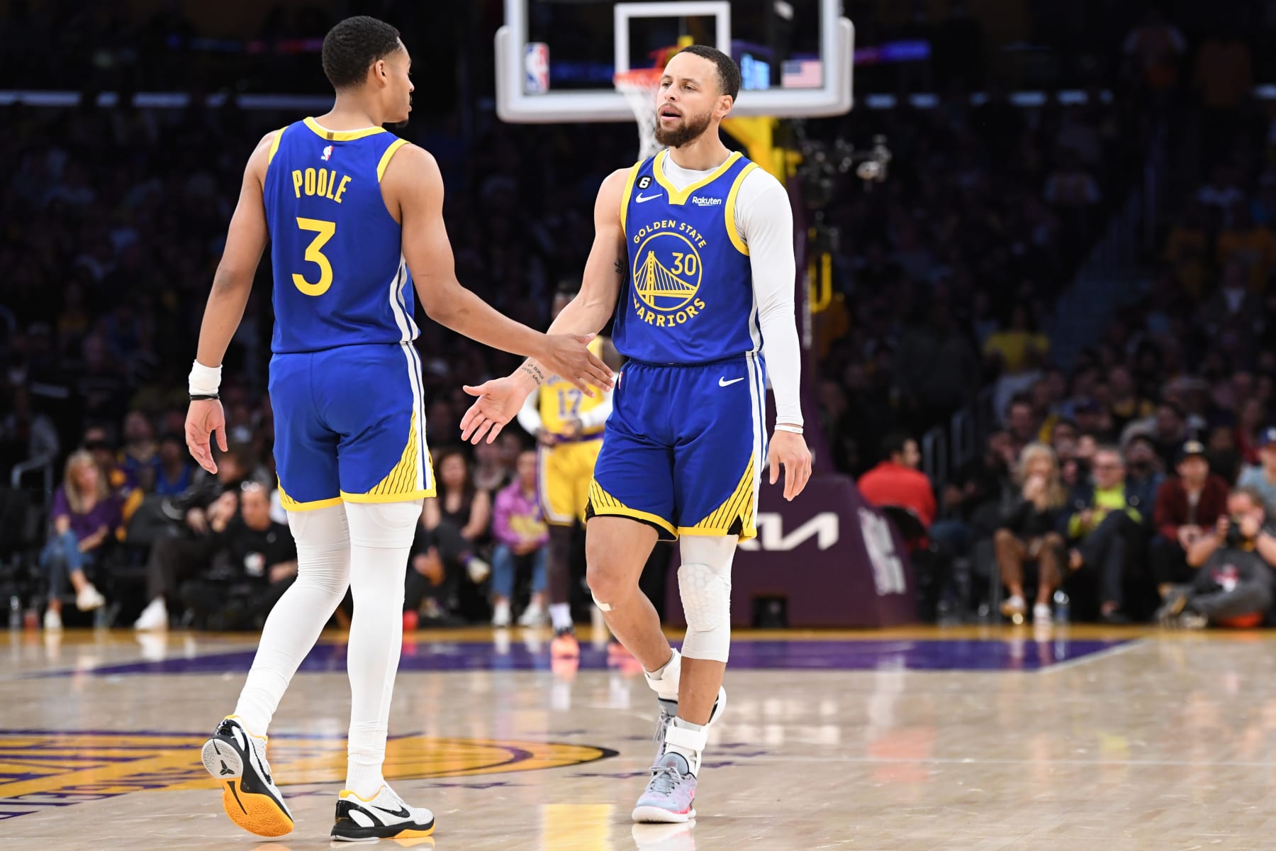LOS ANGELES, CA - MAY 12: Jordan Poole #3 and Stephen Curry #30 of the Golden State Warriors high five during Game Six of the Western Conference Semi-Finals of the 2023 NBA Playoffs against the Los Angeles Lakers on May 12, 2023 at Crypto.com Arena in Los Angeles, California. NOTE TO USER: User expressly acknowledges and agrees that, by downloading and/or using this Photograph, user is consenting to the terms and conditions of the Getty Images License Agreement. Mandatory Copyright Notice: Copyright 2023 NBAE (Photo by Noah Graham/NBAE via Getty Images)