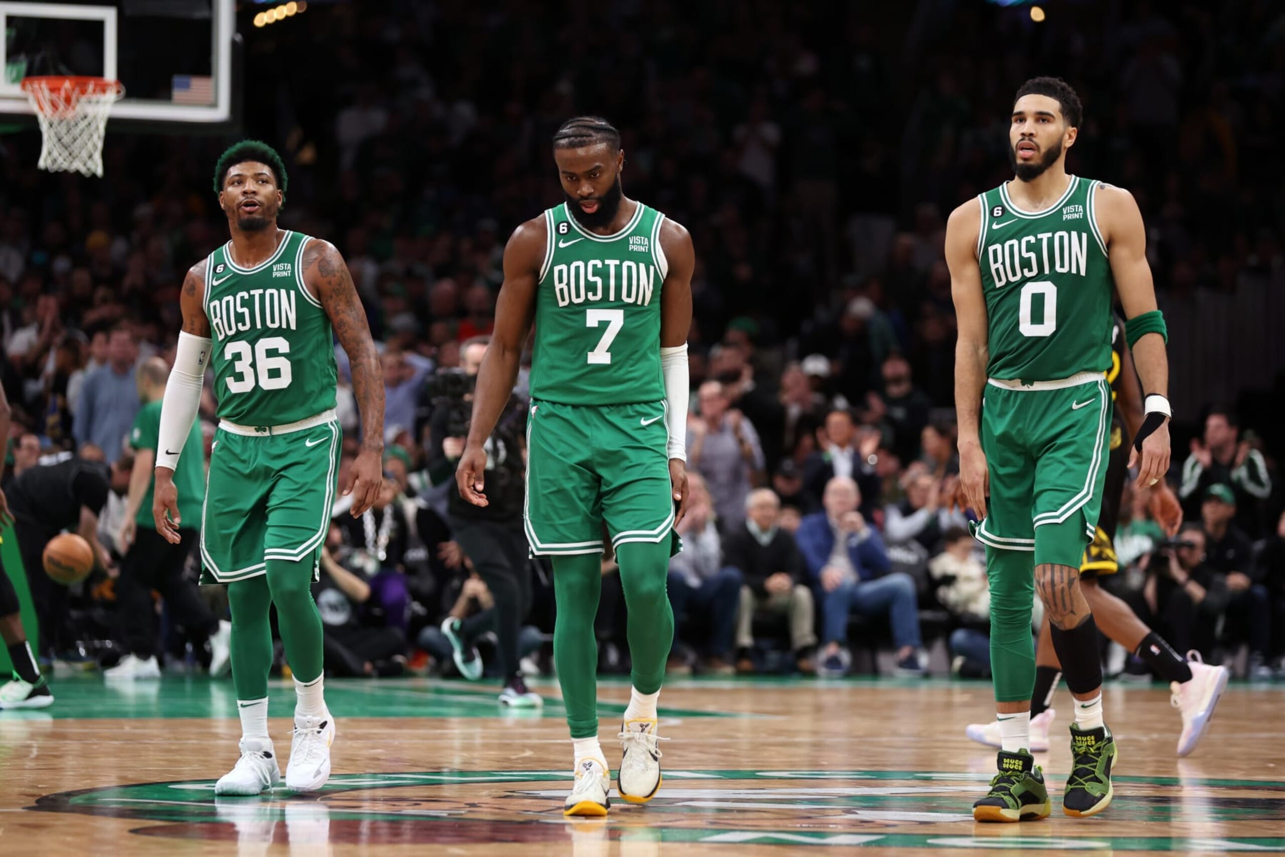 BOSTON, MASSACHUSETTS - JANUARY 19: Marcus Smart #36, Jaylen Brown #7, and Jayson Tatum #0 of the Boston Celtics look on during overtime against the Golden State Warriors at TD Garden on January 19, 2023 in Boston, Massachusetts. The Celtics defeat the Warriors 121-118. NOTE TO USER: User expressly acknowledges and agrees that, by downloading and or using this photograph, User is consenting to the terms and conditions of the Getty Images License Agreement. (Photo by Maddie Meyer/Getty Images)