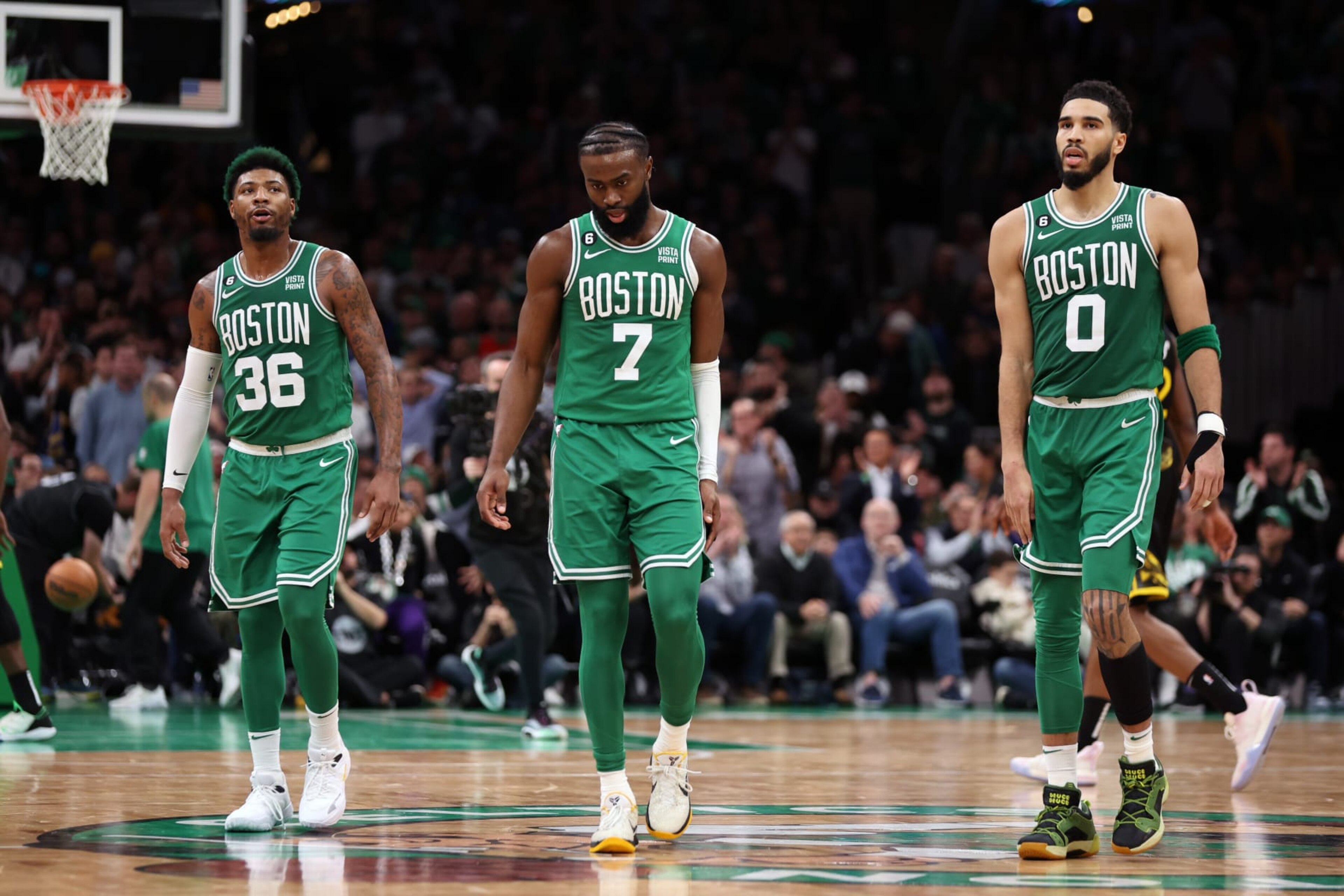BOSTON, MASSACHUSETTS - JANUARY 19: Marcus Smart #36, Jaylen Brown #7, and Jayson Tatum #0 of the Boston Celtics look on during overtime against the Golden State Warriors at TD Garden on January 19, 2023 in Boston, Massachusetts. The Celtics defeat the Warriors 121-118. NOTE TO USER: User expressly acknowledges and agrees that, by downloading and or using this photograph, User is consenting to the terms and conditions of the Getty Images License Agreement. (Photo by Maddie Meyer/Getty Images)