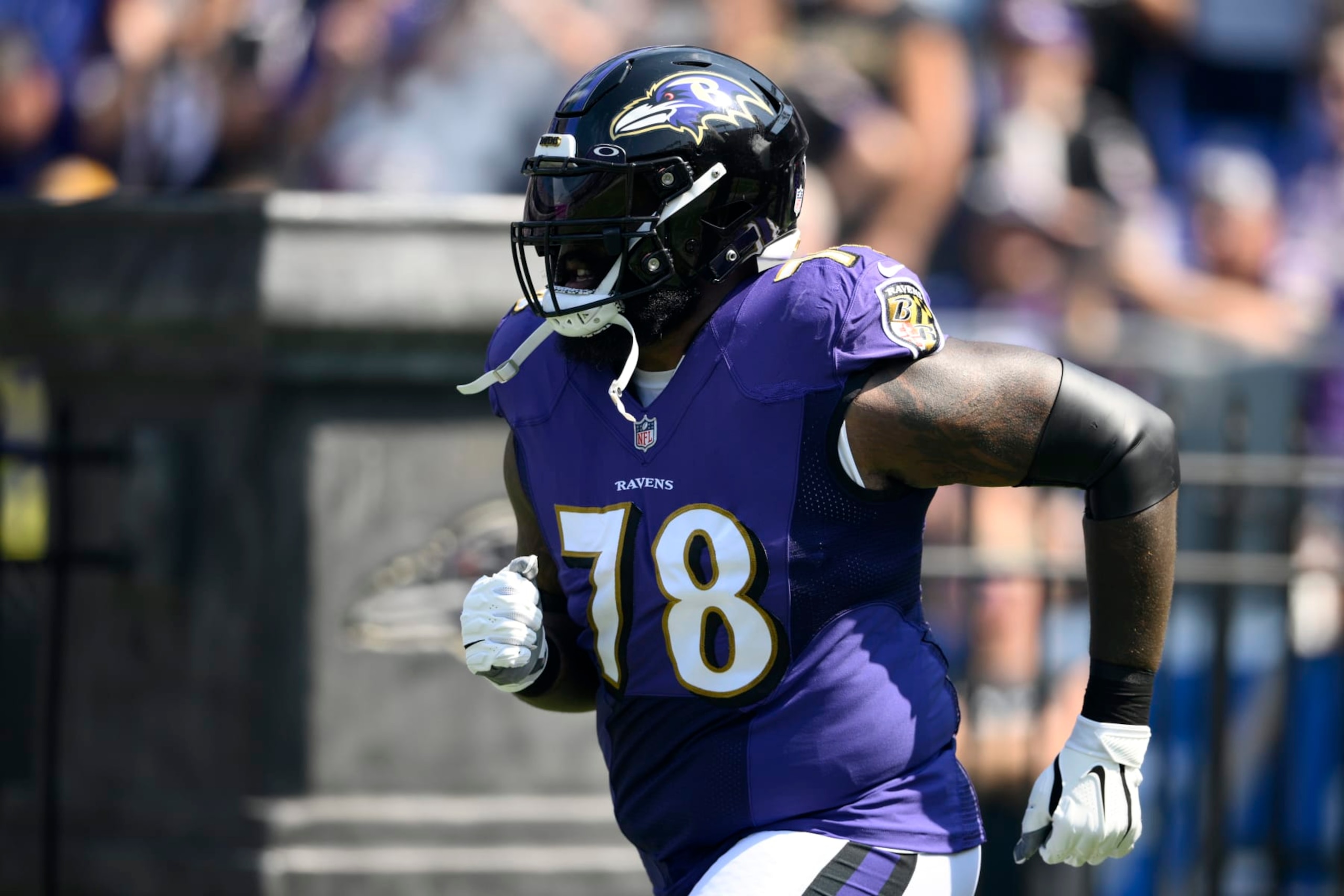 Baltimore Ravens offensive tackle Morgan Moses (78) takes to the field before an NFL football game between the Miami Dolphins and the Baltimore Ravens, Sunday, Sept. 18, 2022, in Baltimore. (AP Photo/Nick Wass)