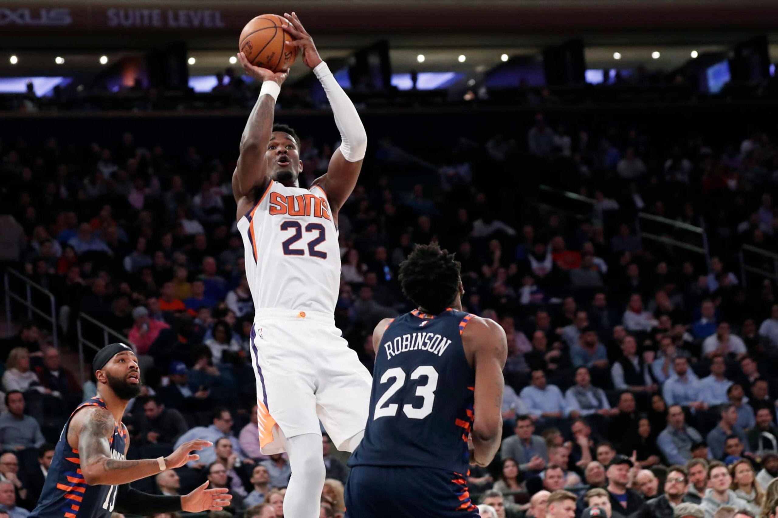 Phoenix Suns center Deandre Ayton (22) shoots with New York Knicks forward Marcus Morris Sr. (13) and Knicks center Mitchell Robinson (23) looking on during the second half of an NBA basketball game in New York, Thursday, Jan. 16, 2020. The Suns defeated the Knicks 121-98. (AP Photo/Kathy Willens) Phoenix Suns center Deandre Ayton (22) shoots with New York Knicks forward Marcus Morris Sr. (13) and Knicks center Mitchell Robinson (23) looking on during the second half of an NBA basketball game in New York, Thursday, Jan. 16, 2020. The Suns defeated the Knicks 121-98. (AP Photo/Kathy Willens)