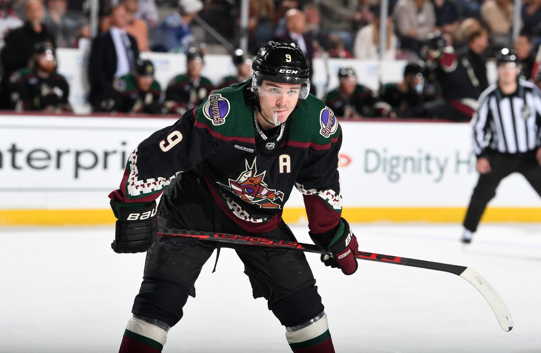 TEMPE, ARIZONA - APRIL 13: Clayton Keller #9 of the Arizona Coyotes gets ready during a face off against the Vancouver Canucks at Mullett Arena on April 13, 2023 in Tempe, Arizona. (Photo by Norm Hall/NHLI via Getty Images)