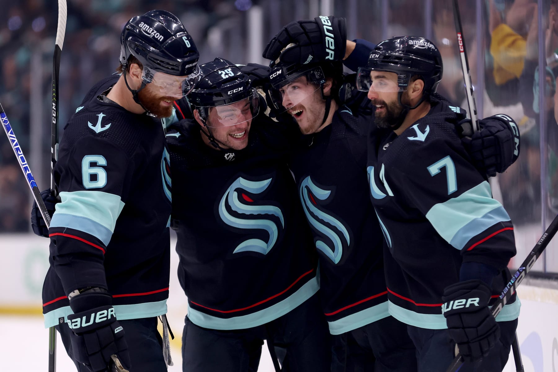 SEATTLE, WASHINGTON - MAY 13: Adam Larsson #6, Vince Dunn #29, Tye Kartye #52 and Jordan Eberle #7 of the Seattle Kraken celebrate a goal by Kartye against the Dallas Stars during the second period in Game Six of the Second Round of the 2023 Stanley Cup Playoffs at Climate Pledge Arena on May 13, 2023 in Seattle, Washington. (Photo by Steph Chambers/Getty Images)
