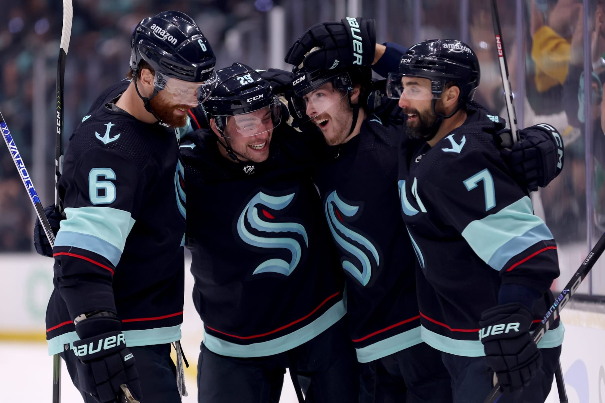SEATTLE, WASHINGTON - MAY 13: Adam Larsson #6, Vince Dunn #29, Tye Kartye #52 and Jordan Eberle #7 of the Seattle Kraken celebrate a goal by Kartye against the Dallas Stars during the second period in Game Six of the Second Round of the 2023 Stanley Cup Playoffs at Climate Pledge Arena on May 13, 2023 in Seattle, Washington. (Photo by Steph Chambers/Getty Images)