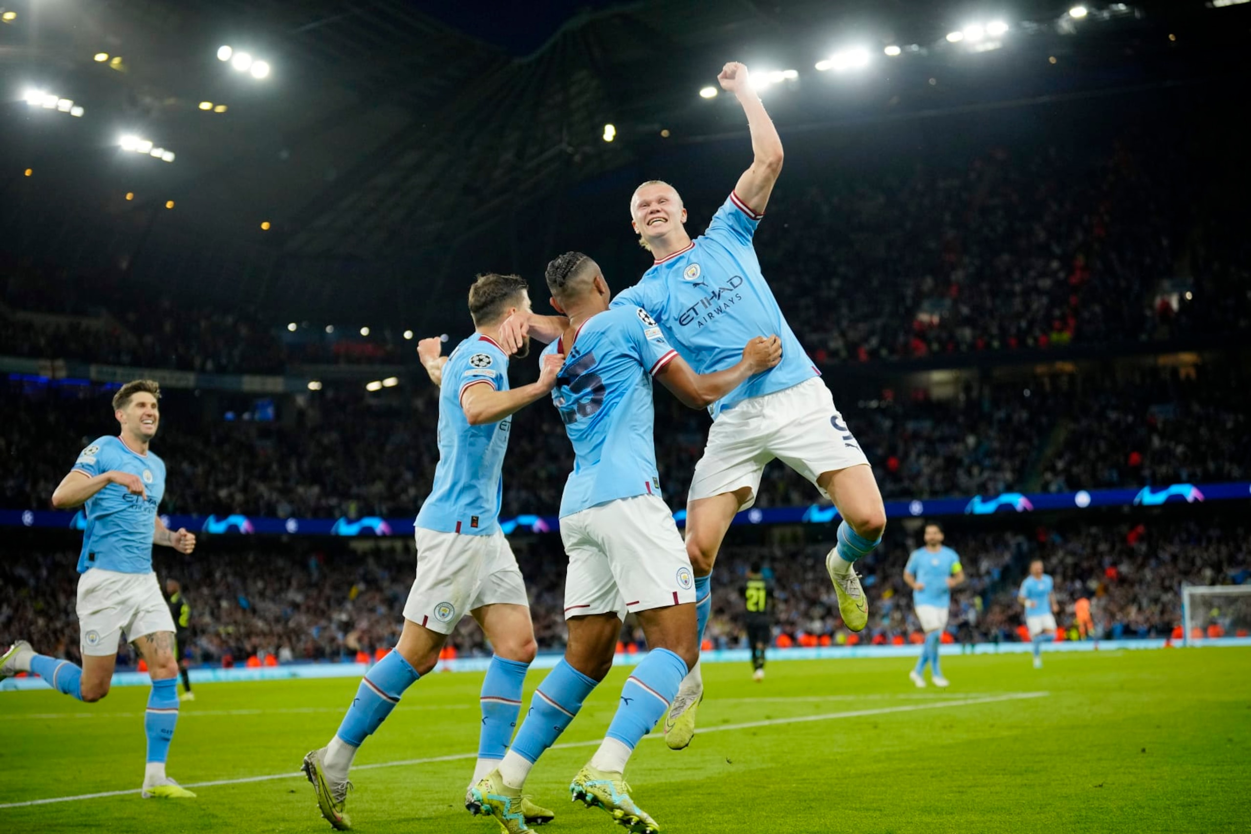 Manchester City's Erling Haaland, right, and his teammates celebrate their third goal during the Champions League semifinal second leg soccer match between Manchester City and Real Madrid at Etihad stadium in Manchester, England, Wednesday, May 17, 2023. (AP Photo/Jon Super)