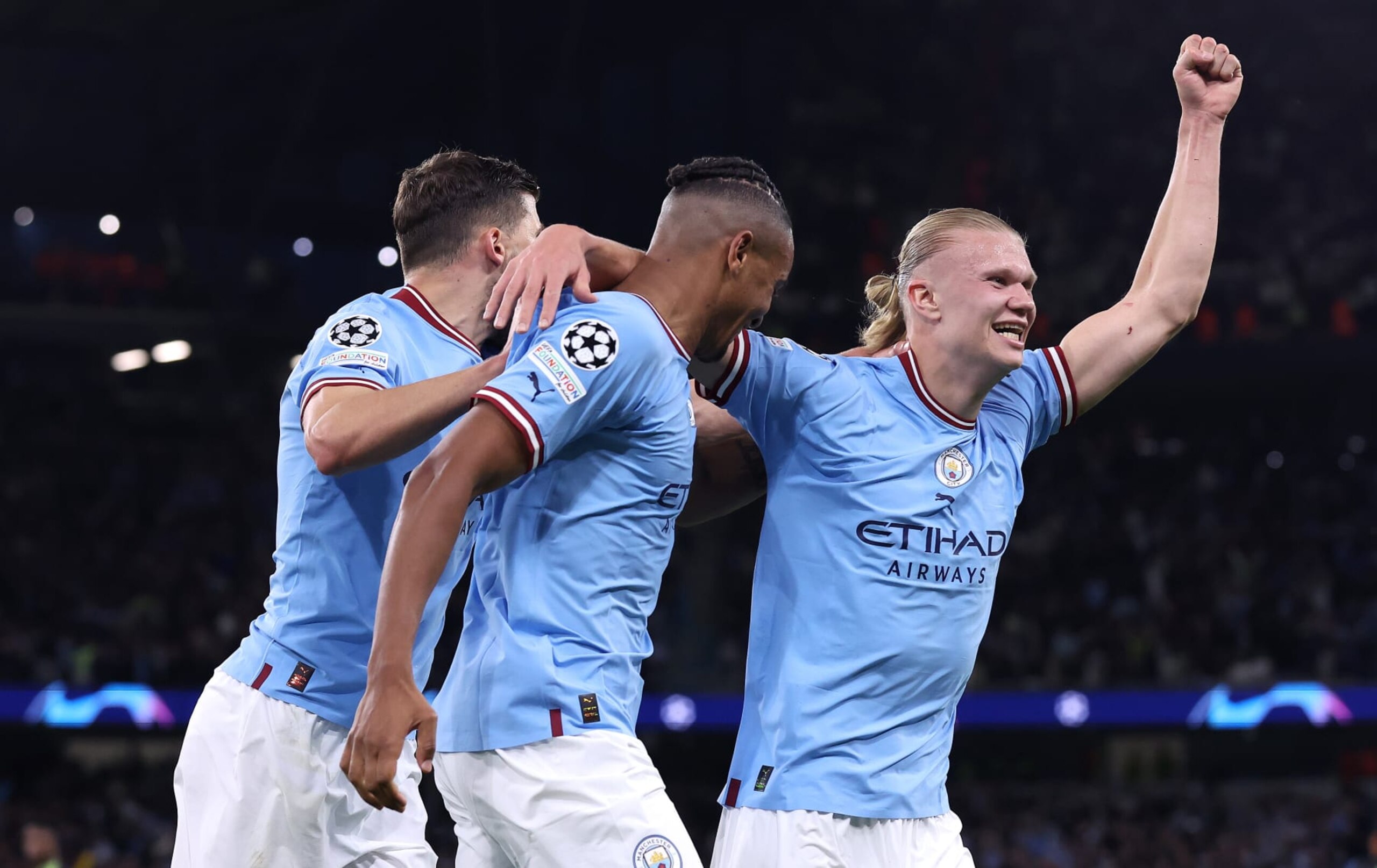 MANCHESTER, ENGLAND - MAY 17: Ruben Dias, Manuel Akanji and Erling Haaland of Manchester City celebrates their teams third goal during the UEFA Champions League semi-final second leg match between Manchester City FC and Real Madrid at Etihad Stadium on May 17, 2023 in Manchester, England. (Photo by Alex Livesey - Danehouse/Getty Images)