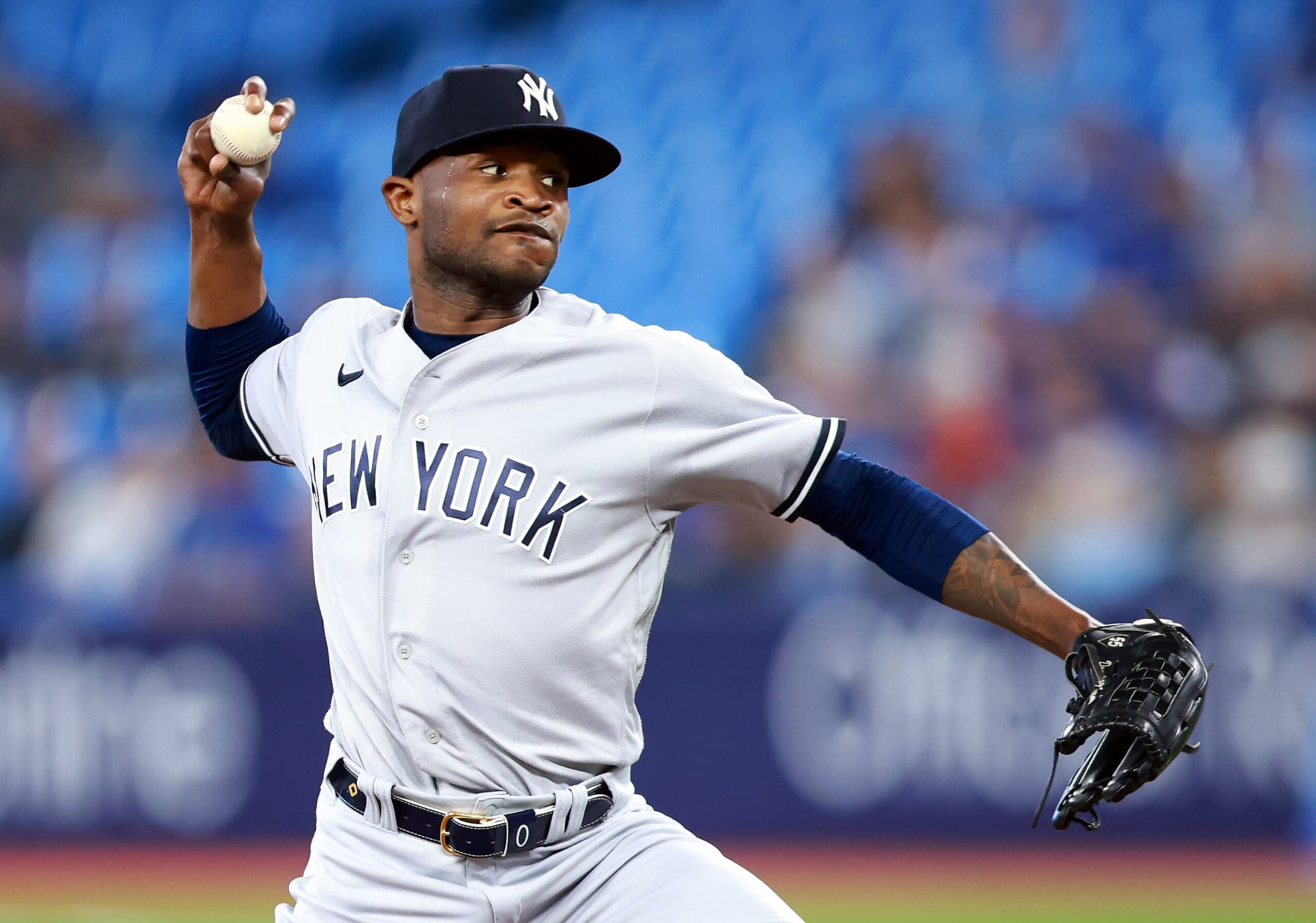 TORONTO, ON - MAY 16:  Domingo German #0 of the New York Yankees delivers a pitch in the first inning against the Toronto Blue Jays at Rogers Centre on May 16, 2023 in Toronto, Ontario, Canada.  (Photo by Vaughn Ridley/Getty Images)