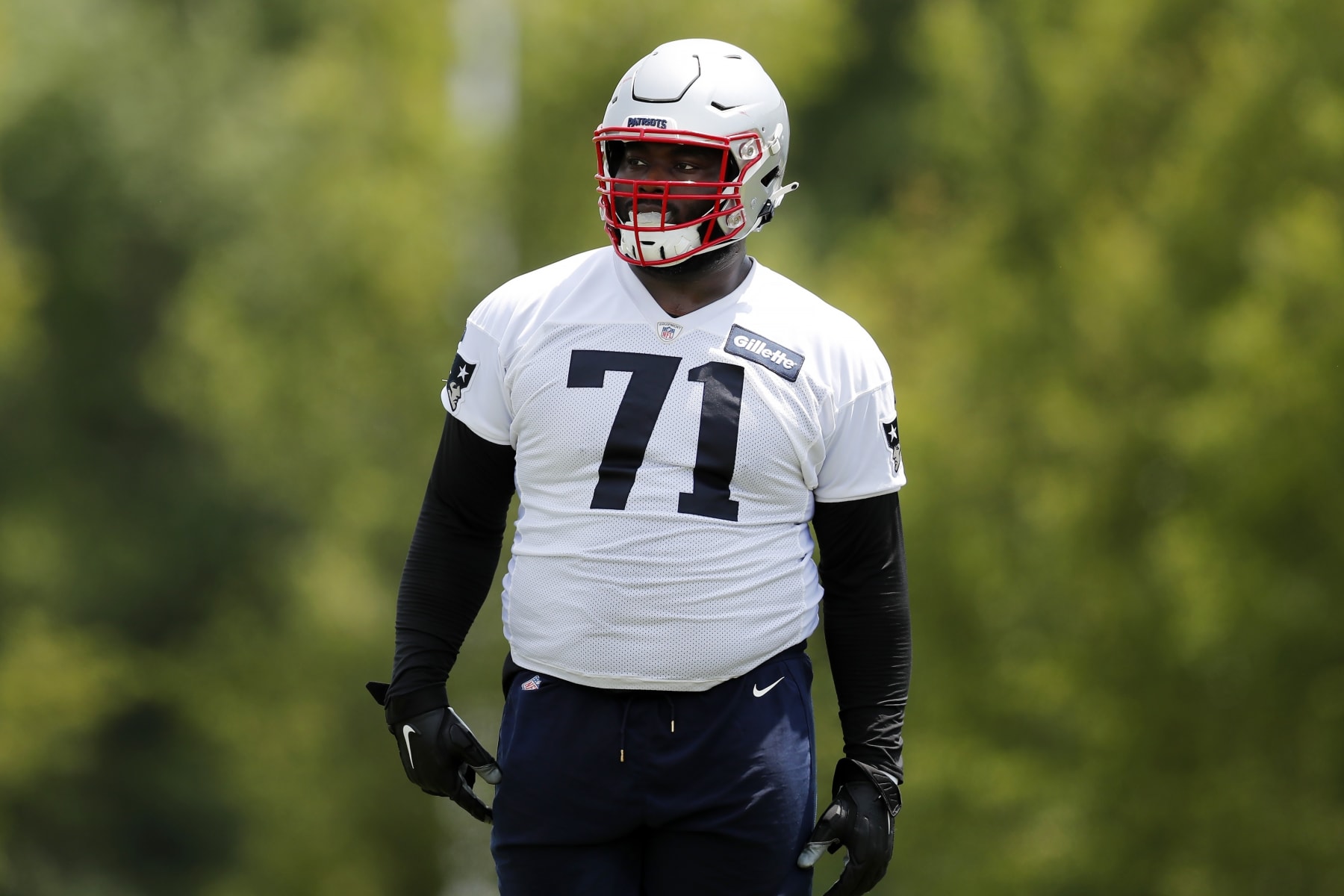 New England Patriots guard Mike Onwenu (71) takes part in drills at the NFL football team's practice facility in Foxborough, Mass., Tuesday, May 31, 2022 (AP Photo/Michael Dwyer)