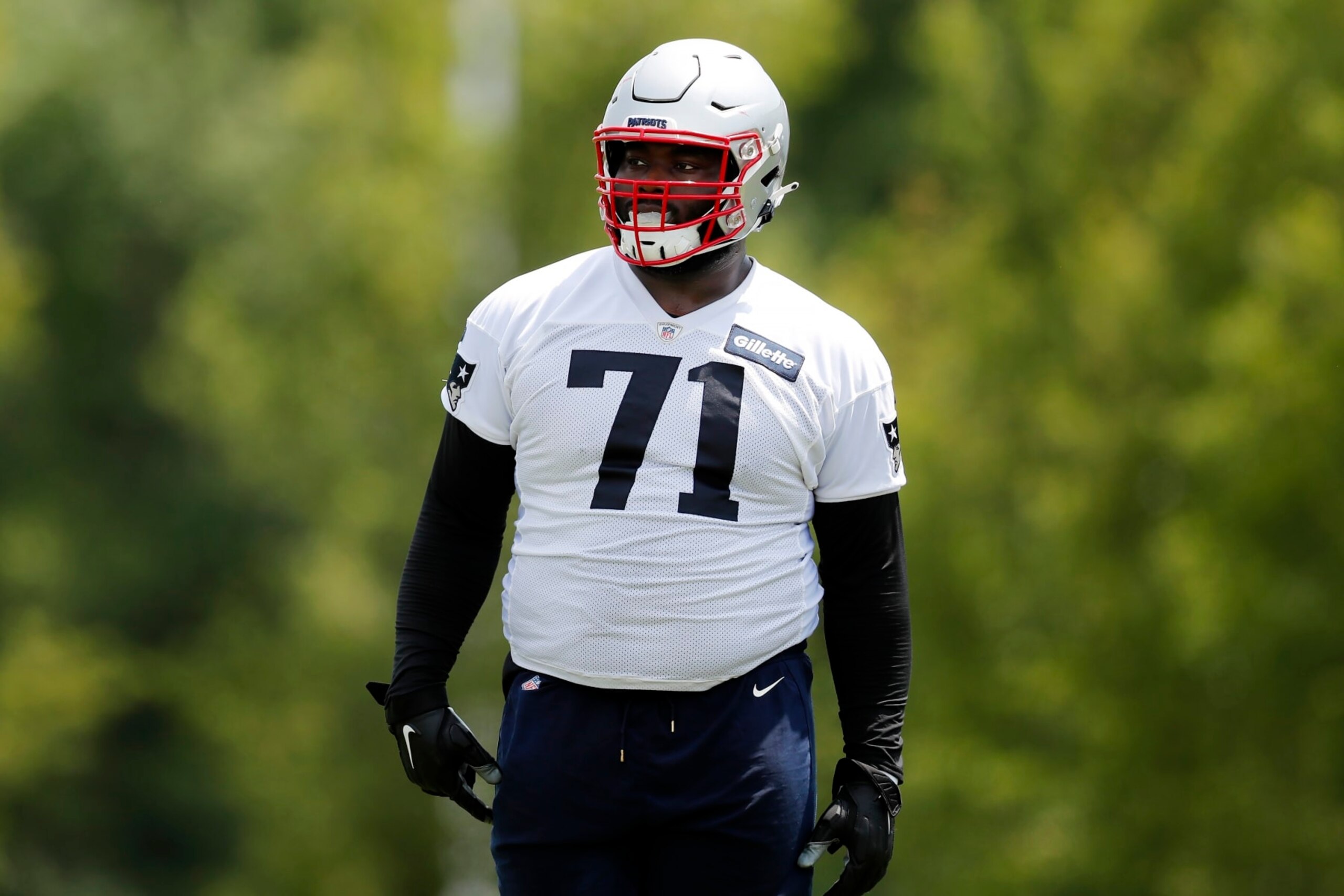 New England Patriots guard Mike Onwenu (71) takes part in drills at the NFL football team's practice facility in Foxborough, Mass., Tuesday, May 31, 2022 (AP Photo/Michael Dwyer)
