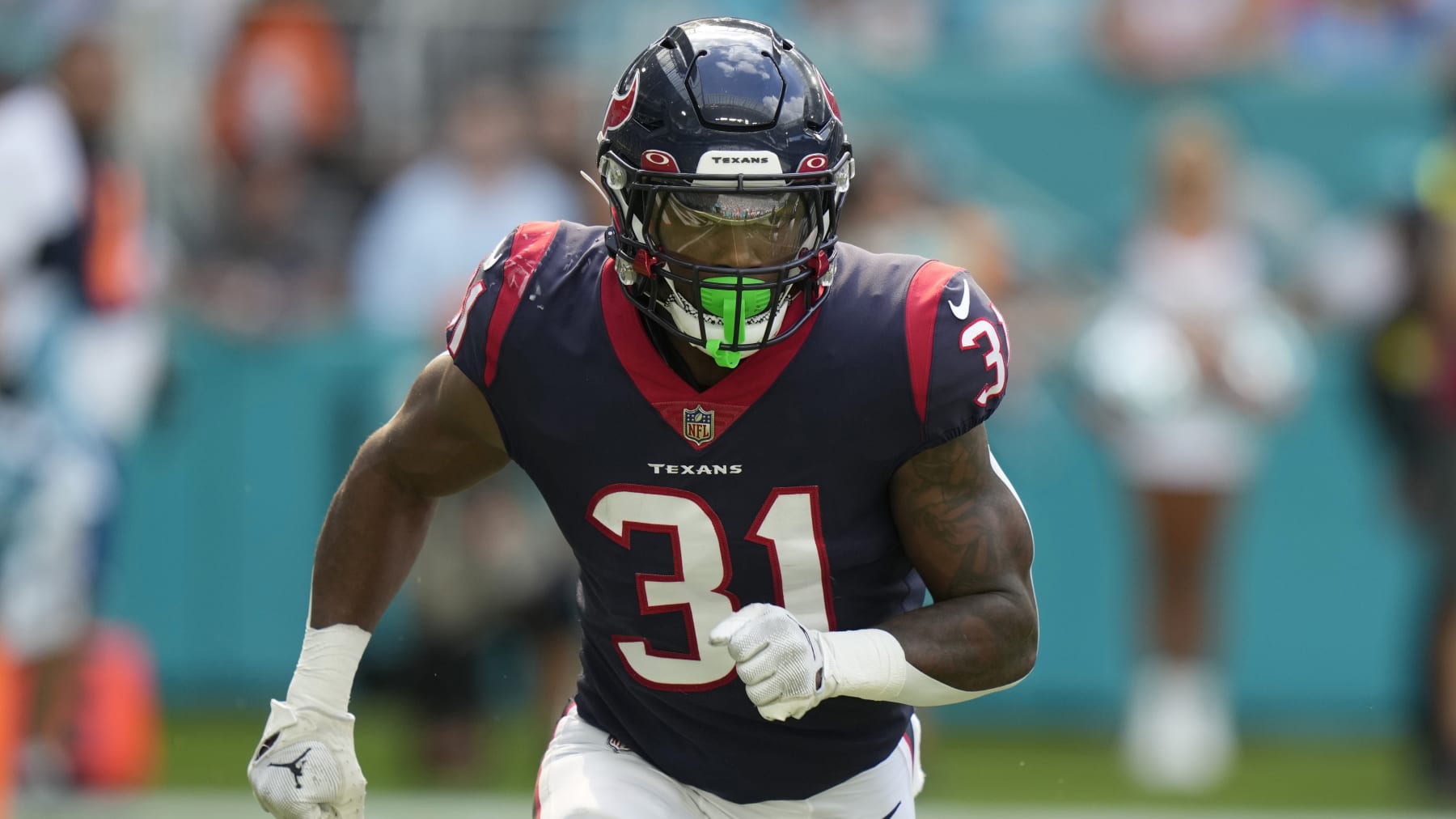 Houston Texans running back Dameon Pierce (31) runs a play during the first half of an NFL football game against the Miami Dolphins, Sunday, Nov. 27, 2022, in Miami Gardens, Fla. (AP Photo/Lynne Sladky)