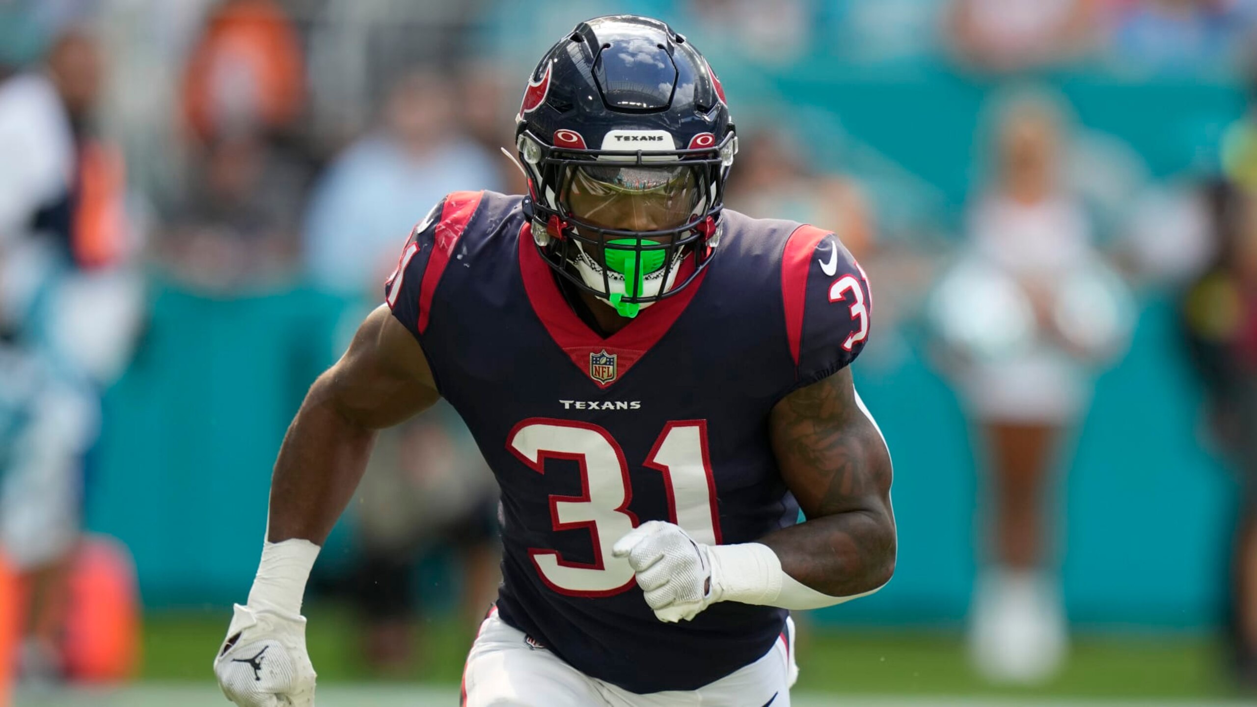 Houston Texans running back Dameon Pierce (31) runs a play during the first half of an NFL football game against the Miami Dolphins, Sunday, Nov. 27, 2022, in Miami Gardens, Fla. (AP Photo/Lynne Sladky)