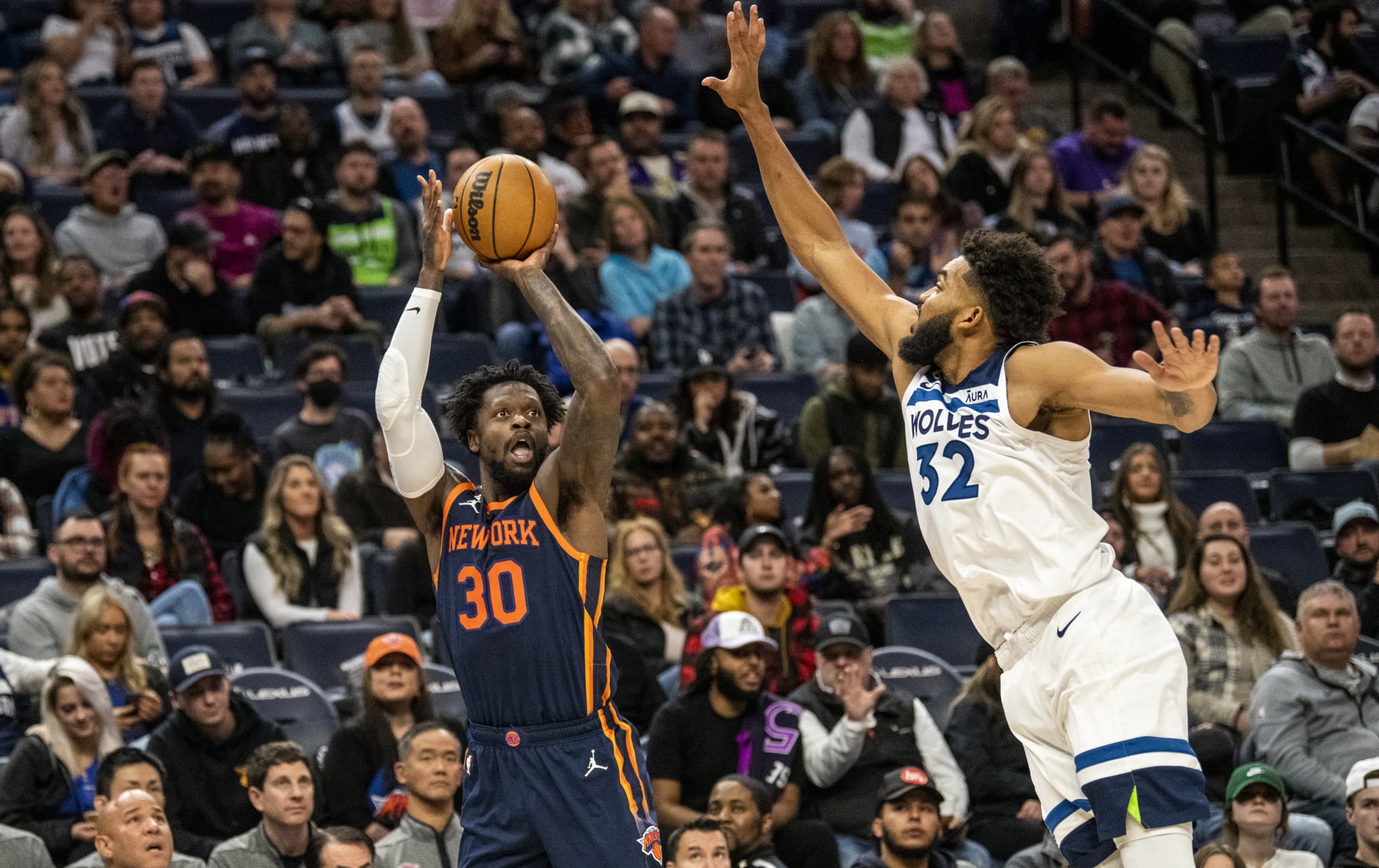 MINNEAPOLIS, MN - NOVEMBER 07: Karl-Anthony Towns #32 of the Minnesota Timberwolves defends Julius Randle #30 of the New York Knicks as he shoots the ball in the second quarter of the game at Target Center on November 7, 2022 in Minneapolis, Minnesota. NOTE TO USER: User expressly acknowledges and agrees that, by downloading and or using this photograph, User is consenting to the terms and conditions of the Getty Images License Agreement. (Photo by Stephen Maturen/Getty Images)