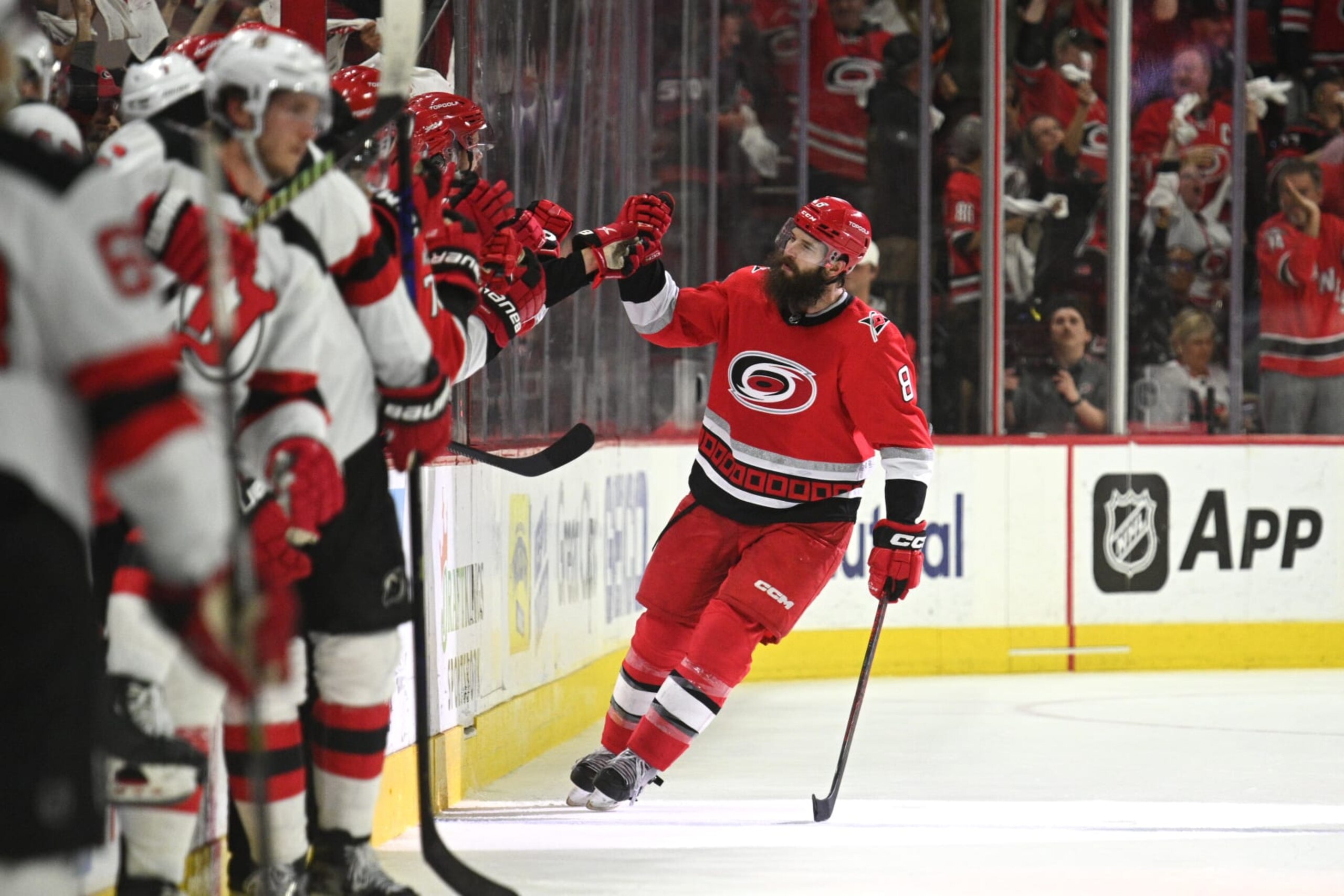 RALEIGH, NC - MAY 11: Carolina Hurricanes Defenceman Brent Burns (8) fist bumps teammates after scoring during game 5 of the second round of the Stanley Cup Playoffs between the New Jersey Devils and the Carolina Hurricanes on May 11, 2023 at PNC Arena in Raleigh, North Carolina. (Photo by Katherine Gawlik/Icon Sportswire via Getty Images)