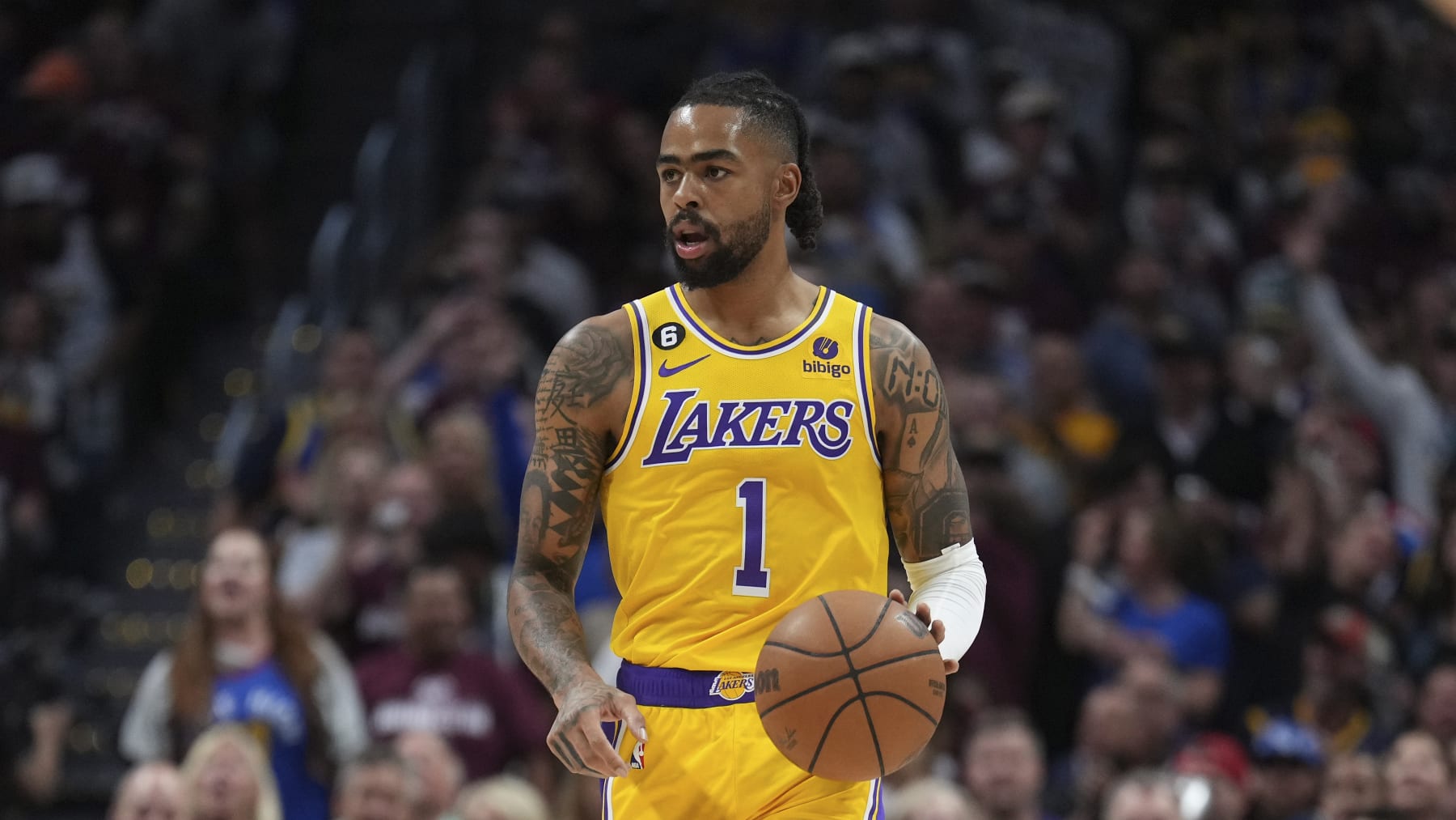 Los Angeles Lakers guard D'Angelo Russell (1) moves the ball up court against the Denver Nuggets during the first half of Game 1 of the NBA basketball Western Conference Finals series, Tuesday, May 16, 2023, in Denver. (AP Photo/Jack Dempsey)