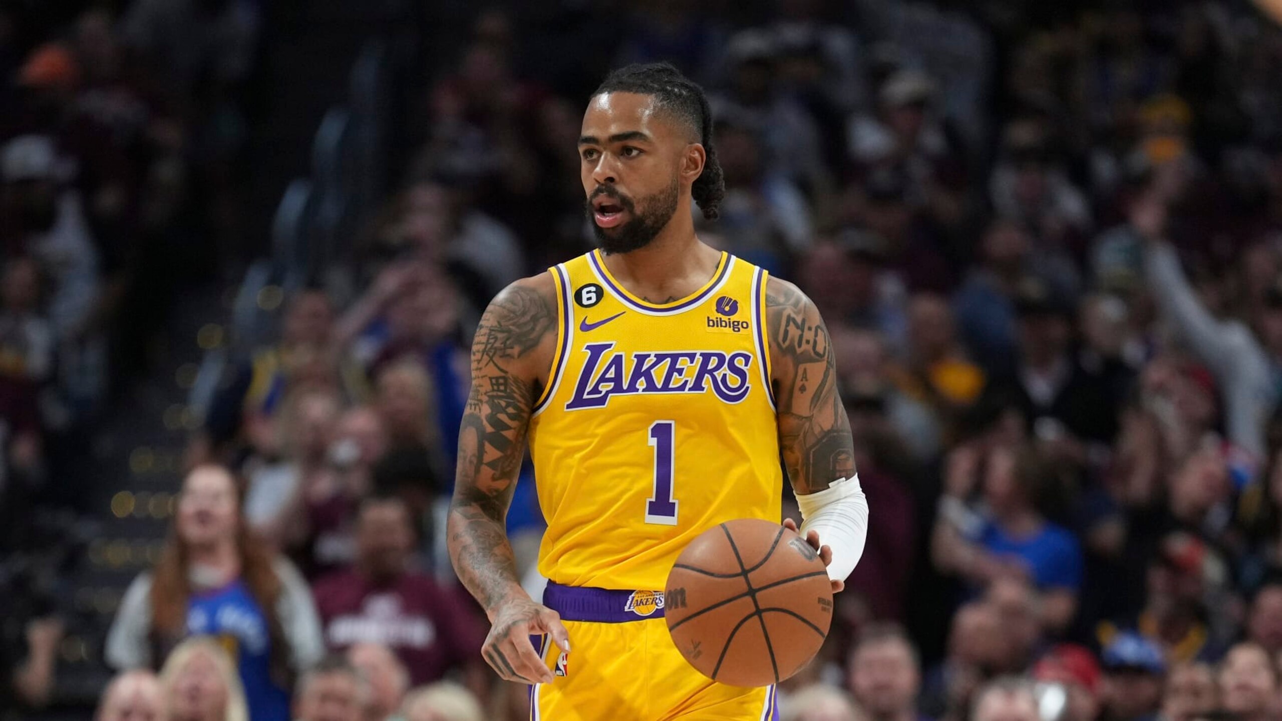 Los Angeles Lakers guard D'Angelo Russell (1) moves the ball up court against the Denver Nuggets during the first half of Game 1 of the NBA basketball Western Conference Finals series, Tuesday, May 16, 2023, in Denver. (AP Photo/Jack Dempsey)