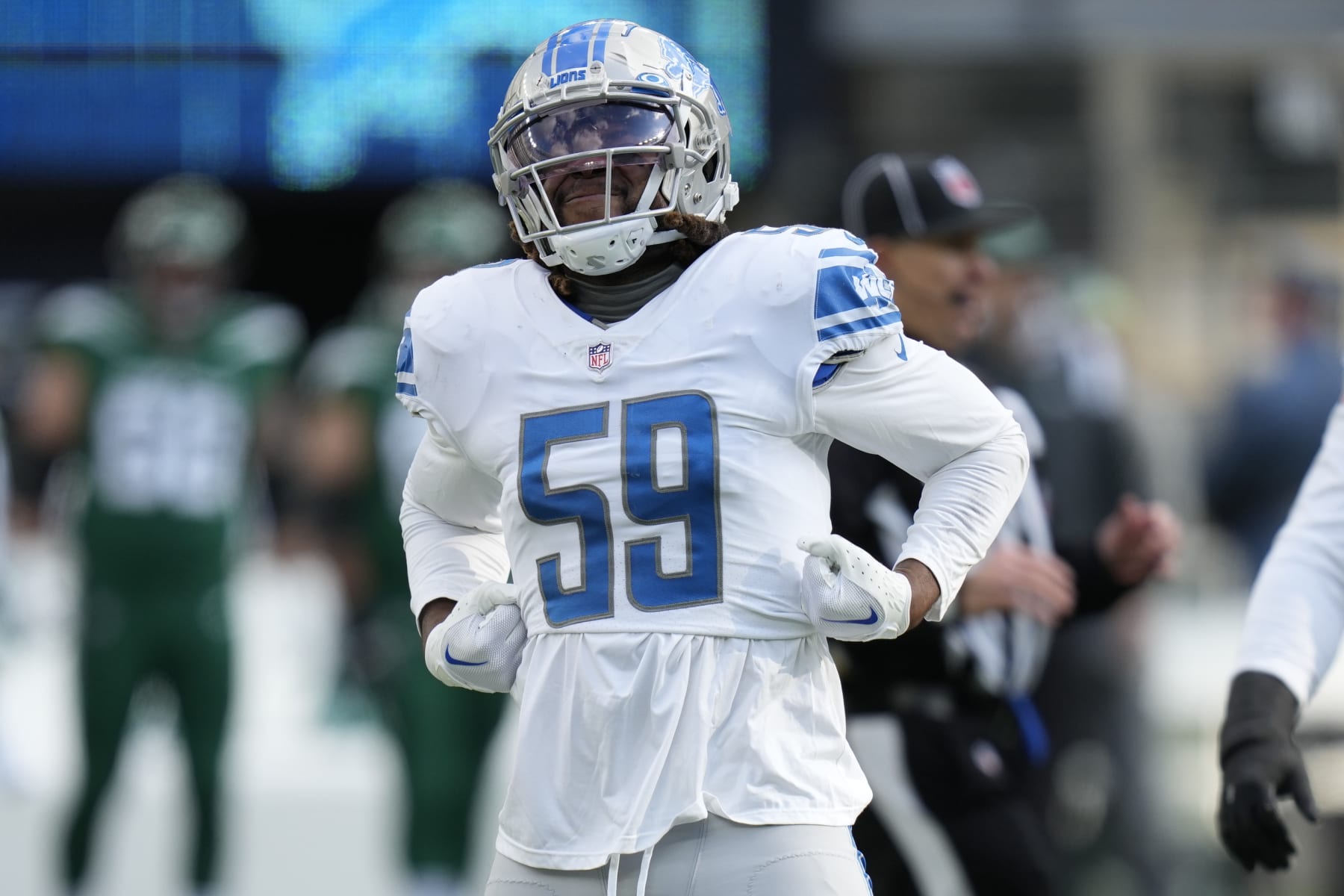 Detroit Lions linebacker James Houston (59) reacts after sacking New York Jets quarterback Zach Wilson (2) during the second quarter of an NFL football game, Sunday, Dec. 18, 2022, in East Rutherford, N.J. (AP Photo/Seth Wenig)