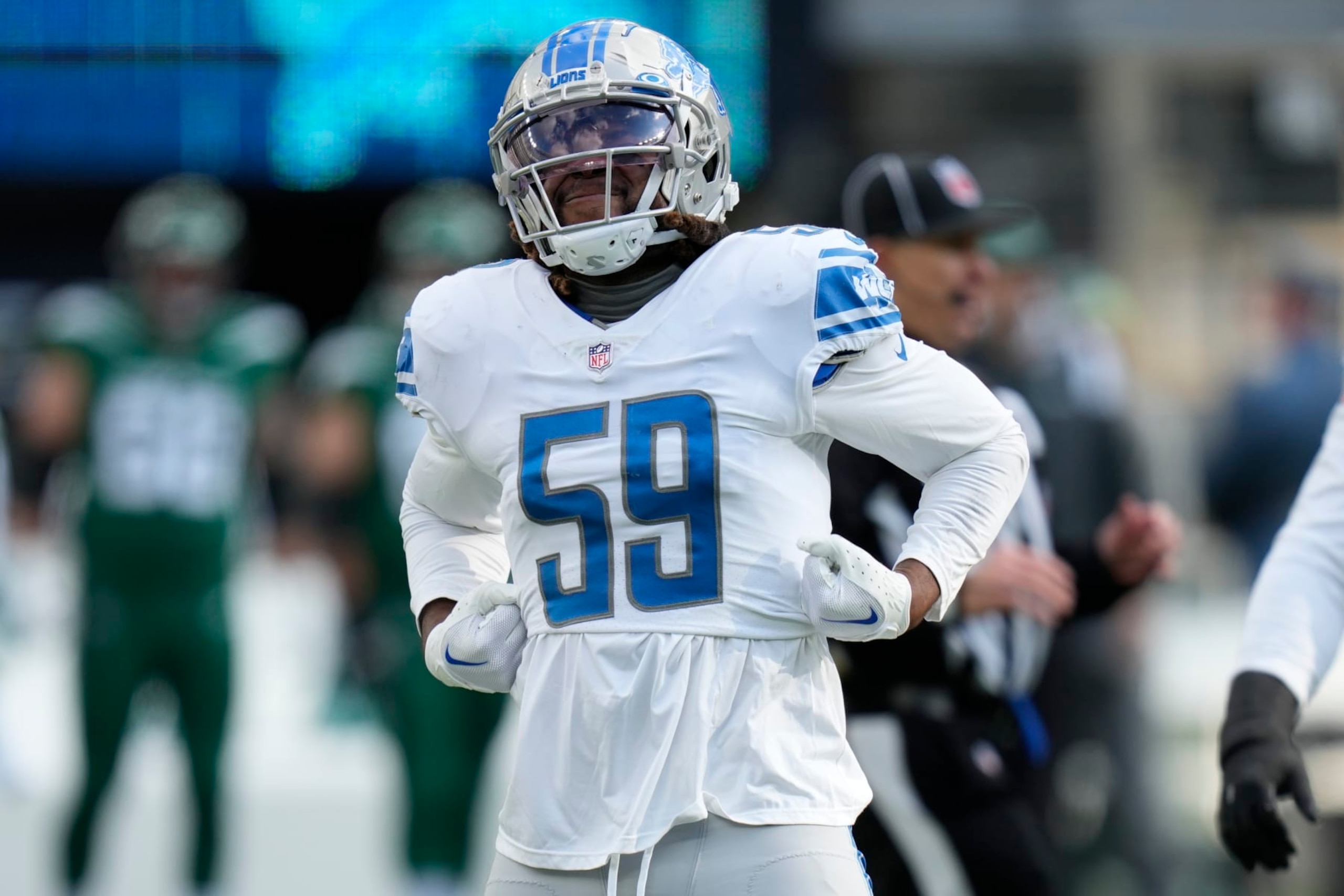 Detroit Lions linebacker James Houston (59) reacts after sacking New York Jets quarterback Zach Wilson (2) during the second quarter of an NFL football game, Sunday, Dec. 18, 2022, in East Rutherford, N.J. (AP Photo/Seth Wenig)
