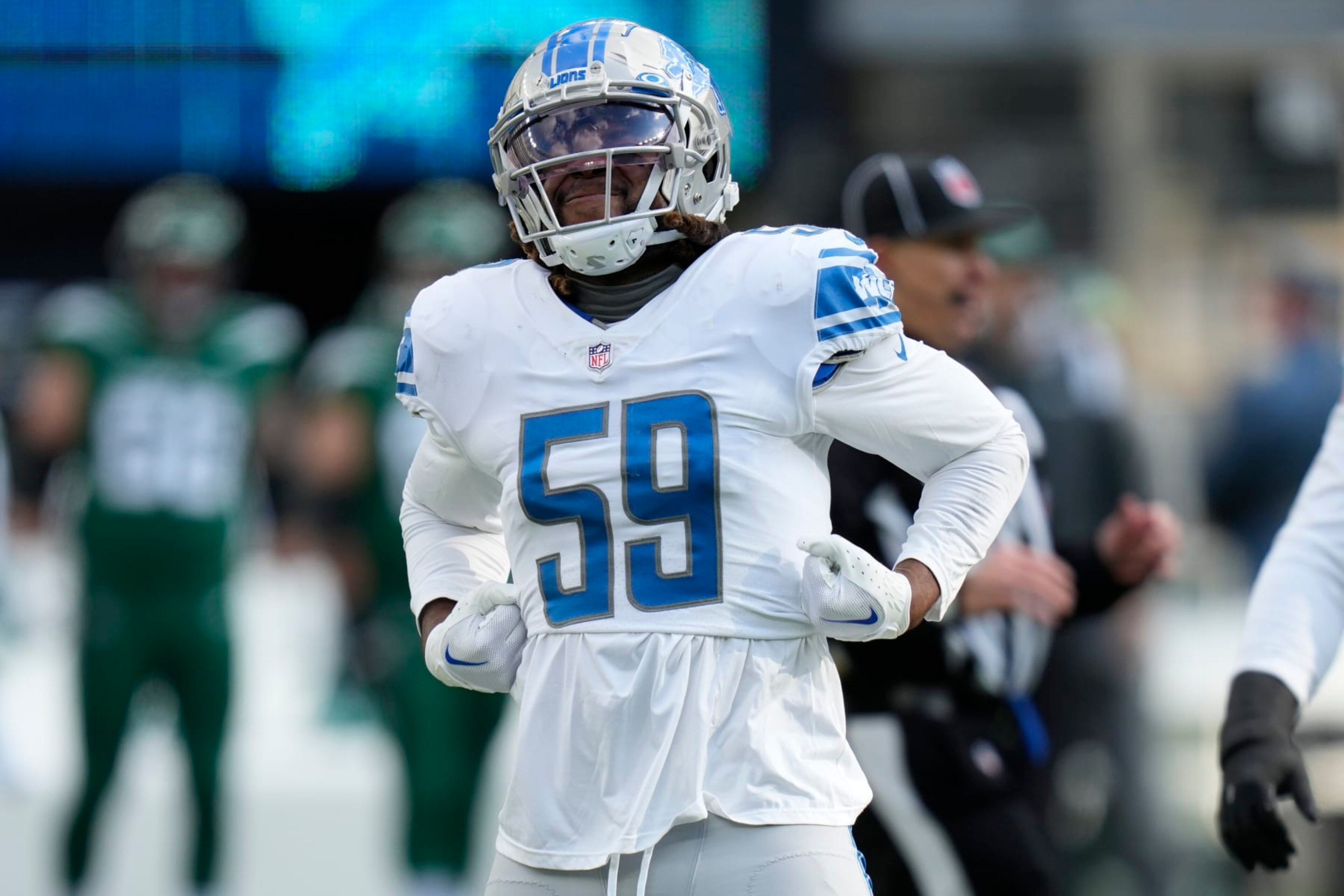 Detroit Lions linebacker James Houston (59) reacts after sacking New York Jets quarterback Zach Wilson (2) during the second quarter of an NFL football game, Sunday, Dec. 18, 2022, in East Rutherford, N.J. (AP Photo/Seth Wenig)