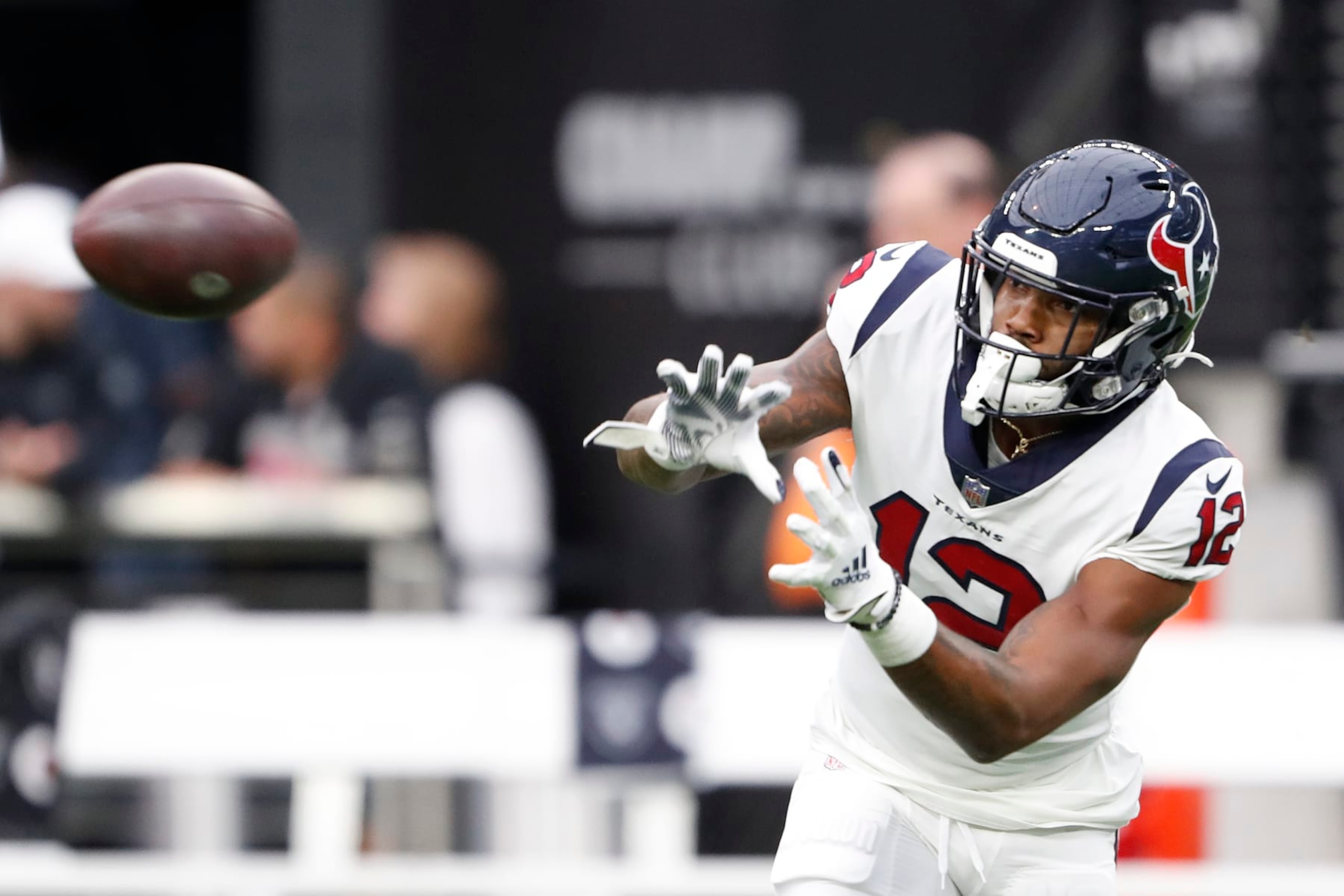 LAS VEGAS, NEVADA - OCTOBER 23: Nico Collins #12 of the Houston Texans warms-up prior to the game against the Las Vegas Raiders at Allegiant Stadium on October 23, 2022 in Las Vegas, Nevada. (Photo by Steve Marcus/Getty Images)
