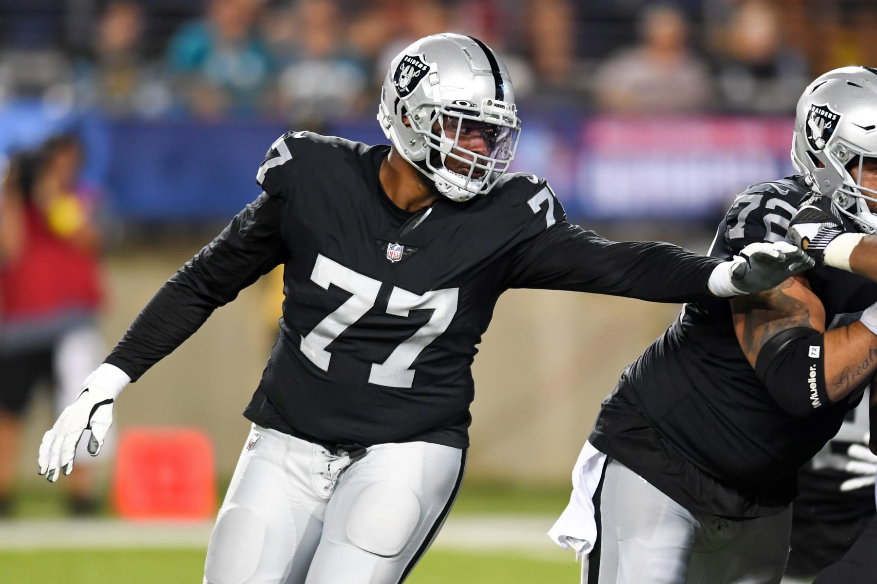 CANTON, OH - AUGUST 04: Thayer Munford Jr. #77 of the Las Vegas Raiders in action during the first half of the 2022 Pro Football Hall of Fame Game against the Jacksonville Jaguars at Tom Benson Hall of Fame Stadium on August 04, 2022 in Canton, Ohio. (Photo by Nick Cammett/Diamond Images via Getty Images)
