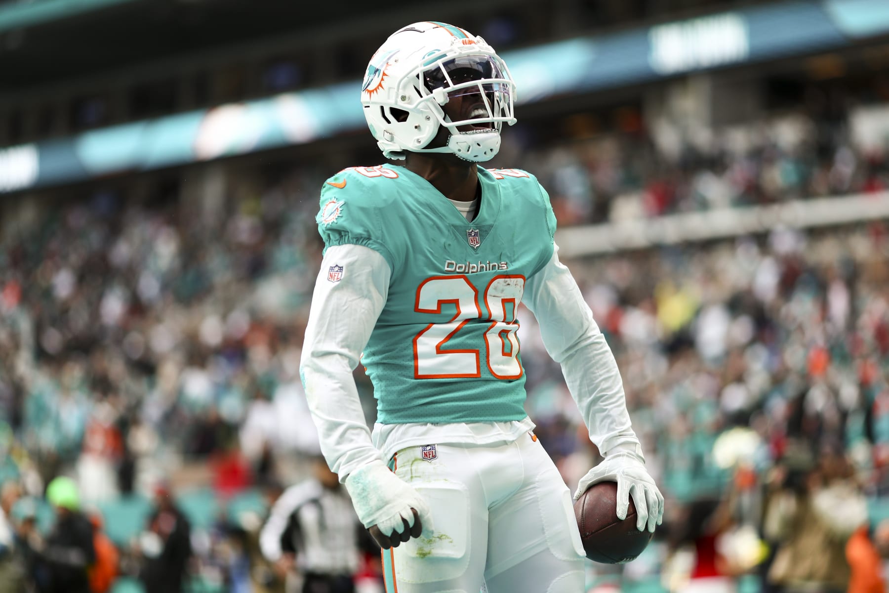 MIAMI GARDENS, FL - DECEMBER 25: Kader Kohou #28 of the Miami Dolphins celebrates after intercepting a pass in the end zone during the fourth quarter of an NFL football game against the Green Bay Packers at Hard Rock Stadium on December 25, 2022 in Miami Gardens, Florida. (Photo by Kevin Sabitus/Getty Images)