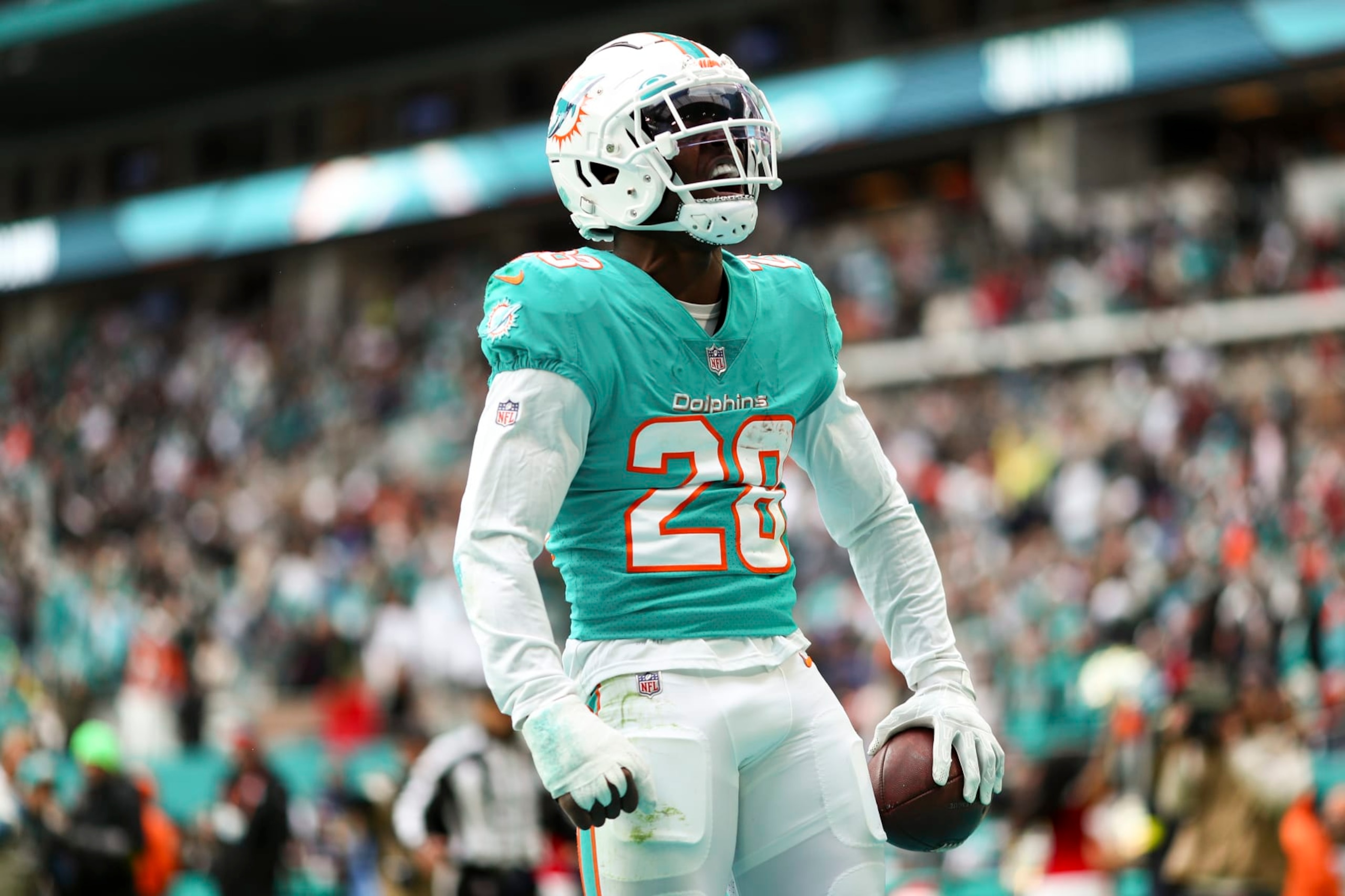MIAMI GARDENS, FL - DECEMBER 25: Kader Kohou #28 of the Miami Dolphins celebrates after intercepting a pass in the end zone during the fourth quarter of an NFL football game against the Green Bay Packers at Hard Rock Stadium on December 25, 2022 in Miami Gardens, Florida. (Photo by Kevin Sabitus/Getty Images)