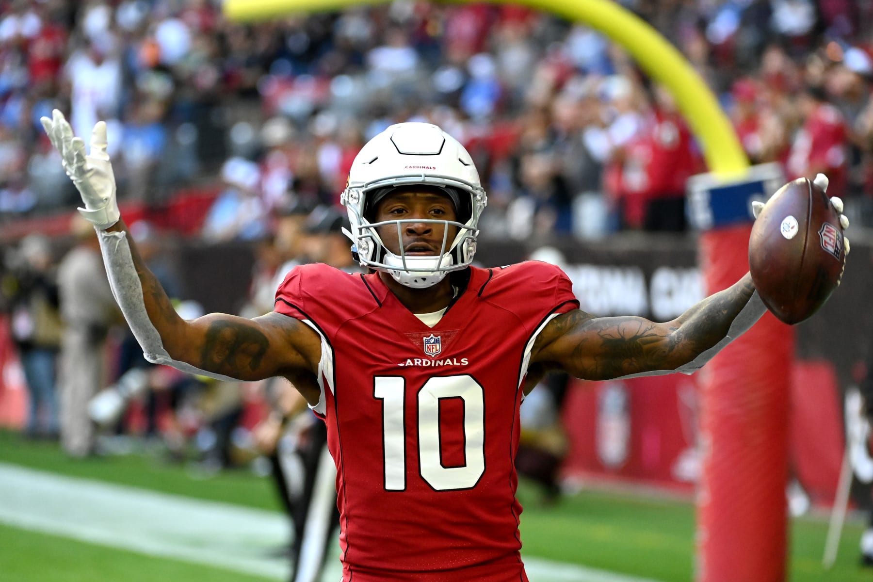 GLENDALE, ARIZONA - NOVEMBER 27: DeAndre Hopkins #10 of the Arizona Cardinals celebrates after scoring a touchdown in the first quarter of a game against the Los Angeles Chargers at State Farm Stadium on November 27, 2022 in Glendale, Arizona. (Photo by Norm Hall/Getty Images)
