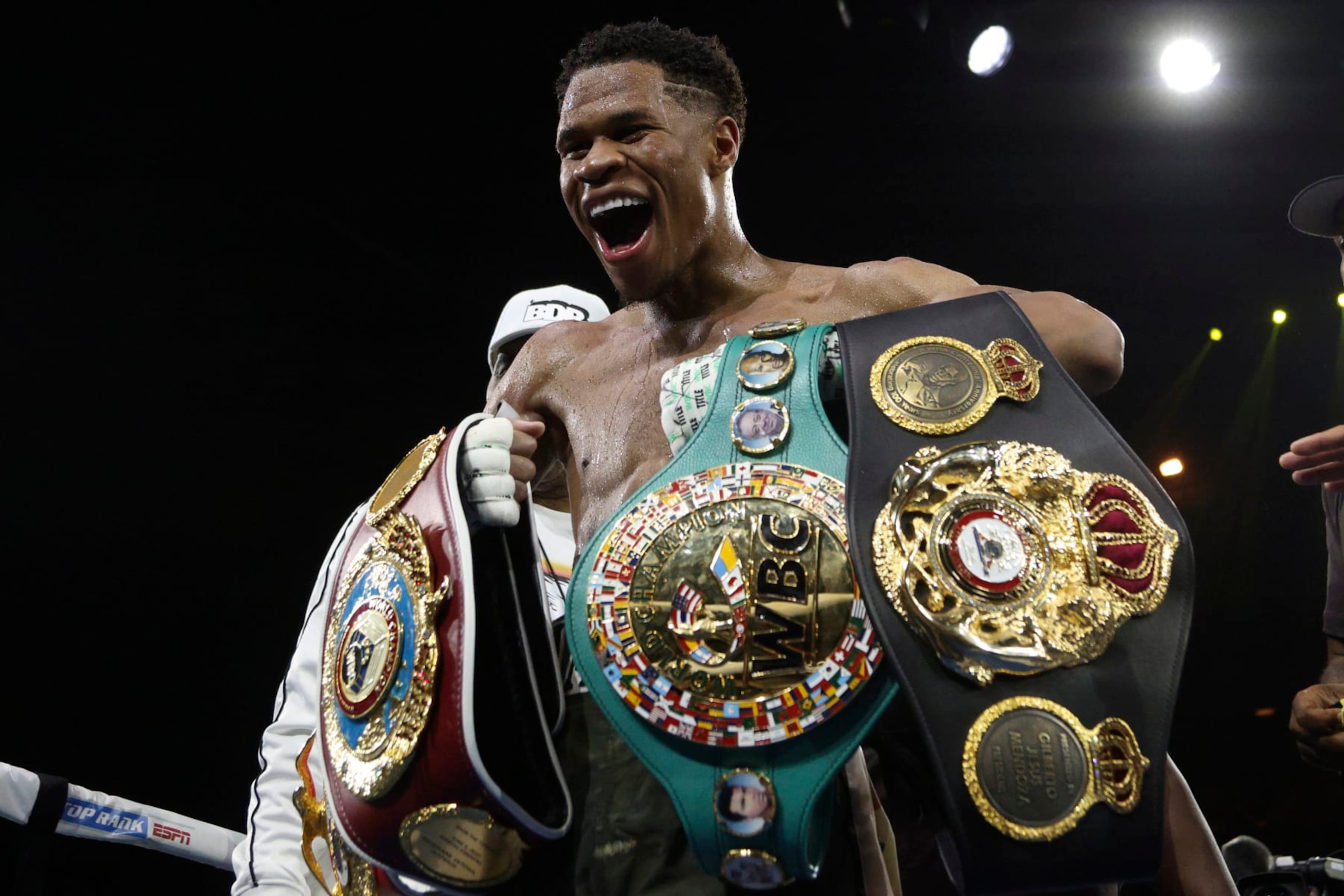 United States' Devin Haney displays his belts after defeating George Kambosos Jr. of Australia as Haney defends his undisputed lightweight boxing title in Melbourne, Sunday, Oct. 16, 2022. (AP Photo/Hamish Blair) United States' Devin Haney displays his belts after defeating George Kambosos Jr. of Australia as Haney defends his undisputed lightweight boxing title in Melbourne, Sunday, Oct. 16, 2022. (AP Photo/Hamish Blair)