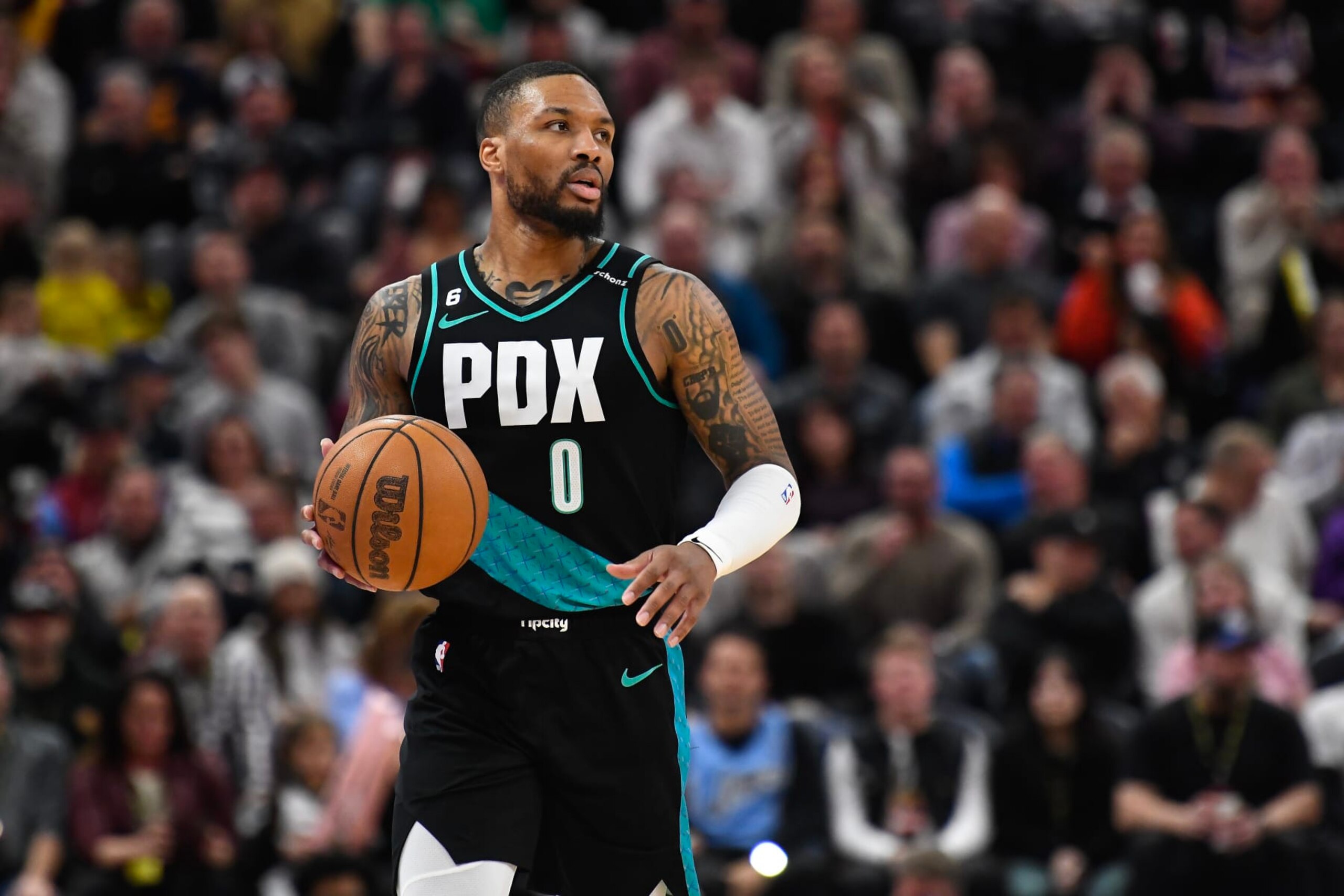 SALT LAKE CITY, UTAH - MARCH 22: Damian Lillard #0 of the Portland Trail Blazers brings the ball up court during the second half against the Utah Jazz at Vivint Arena on March 22, 2023 in Salt Lake City, Utah. NOTE TO USER: User expressly acknowledges and agrees that, by downloading and or using this photograph, User is consenting to the terms and conditions of the Getty Images License Agreement. (Photo by Alex Goodlett/Getty Images)