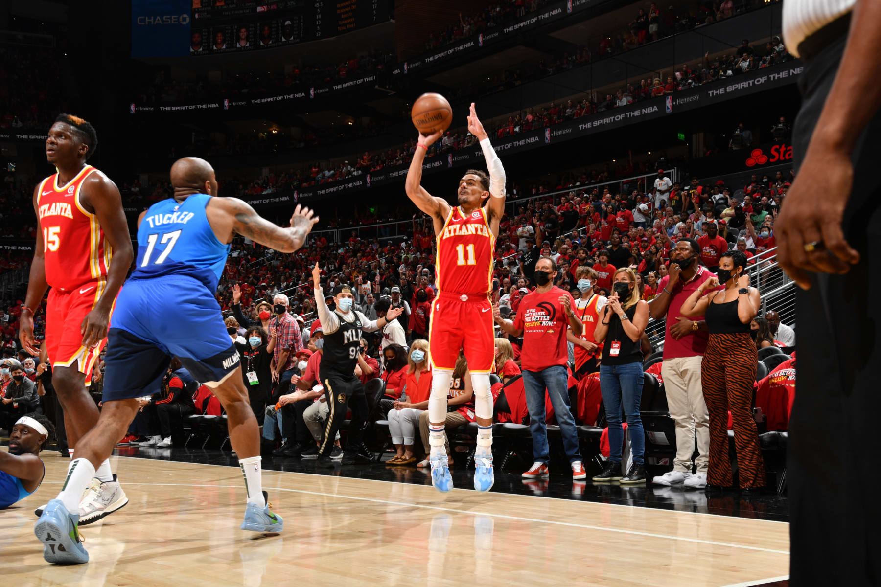 ATLANTA, GA - JUNE 27: Trae Young #11 of the Atlanta Hawks shoots a three-pointer against the Milwaukee Bucks during Game 3 of the Eastern Conference Finals of the 2021 NBA Playoffs on June 27, 2021 at State Farm Arena in Atlanta, Georgia. NOTE TO USER: User expressly acknowledges and agrees that, by downloading and/or using this Photograph, user is consenting to the terms and conditions of the Getty Images License Agreement. Mandatory Copyright Notice: Copyright 2021 NBAE (Photo by Jesse D. Garrabrant/NBAE via Getty Images)