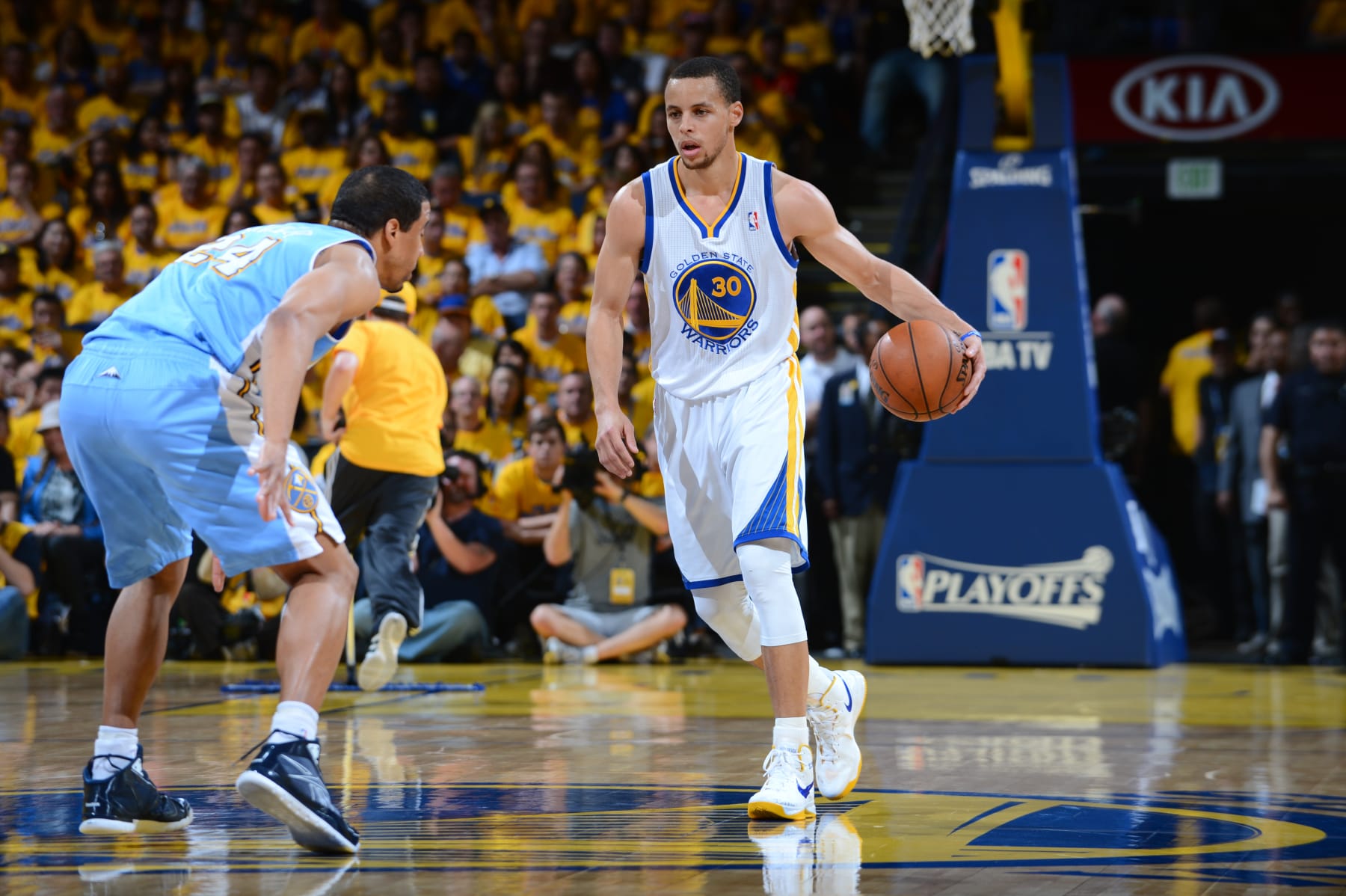 OAKLAND, CA - APRIL 28: Stephen Curry #30 of the Golden State Warriors controls the ball against Andre Miller #24 of the Denver Nuggets in Game Four of the Western Conference Quarterfinals during the 2013 NBA Playoffs on April 28, 2013 at the Oracle Arena in Oakland, California. NOTE TO USER: User expressly acknowledges and agrees that, by downloading and/or using this Photograph, user is consenting to the terms and conditions of the Getty Images License Agreement. Mandatory Copyright Notice: Copyright 2013 NBAE (Photo by Garrett W. Ellwood/NBAE via Getty Images)
