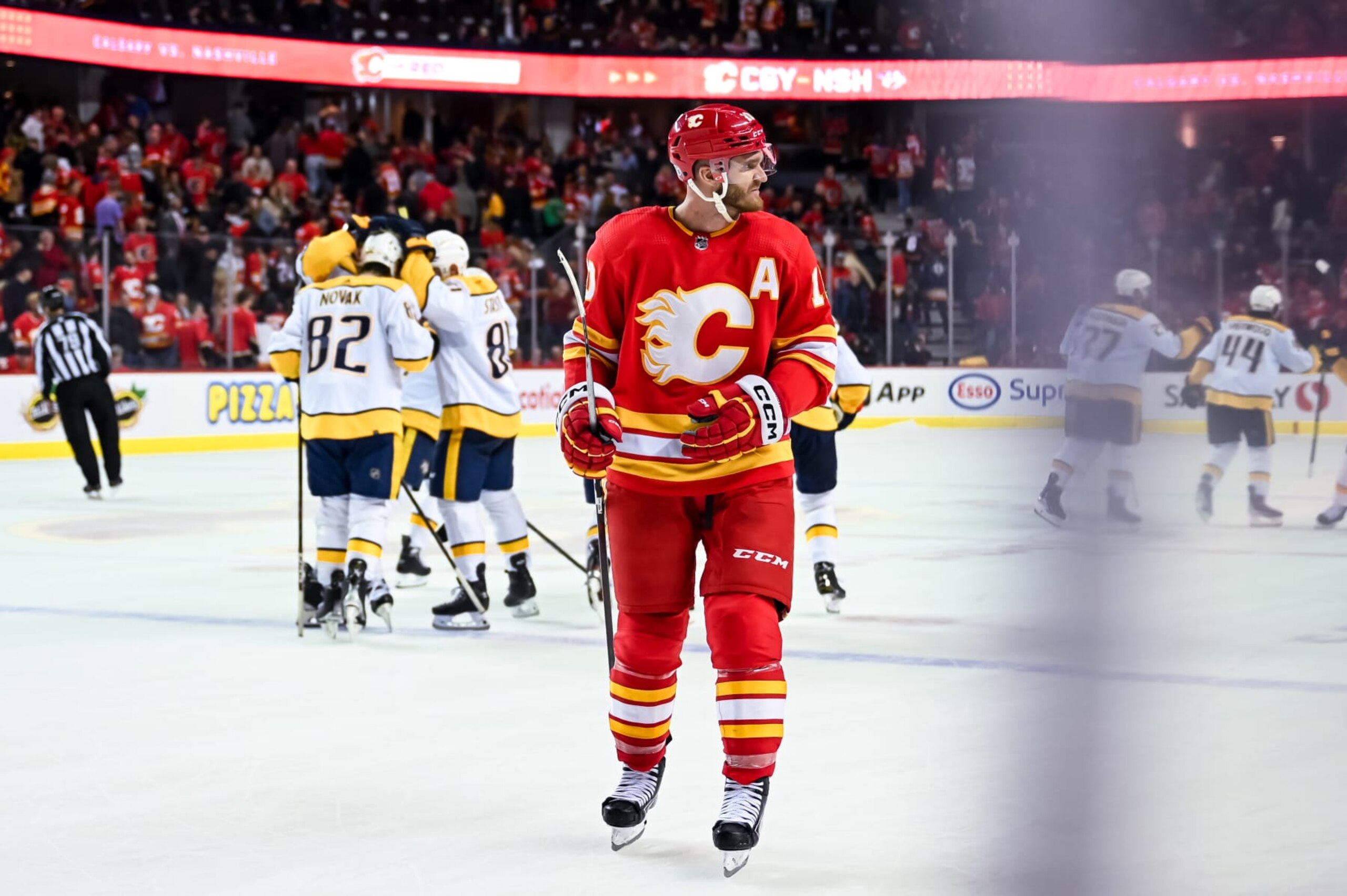 CALGARY, AB - APRIL 10: Calgary Flames Left Wing Jonathan Huberdeau (10) looks on as the Nashville Predators celebrate their 3-2 shootout win after an NHL game on April 10, 2023, at the Scotiabank Saddledome in Calgary, AB. (Photo by Brett Holmes/Icon Sportswire via Getty Images) CALGARY, AB - APRIL 10: Calgary Flames Left Wing Jonathan Huberdeau (10) looks on as the Nashville Predators celebrate their 3-2 shootout win after an NHL game on April 10, 2023, at the Scotiabank Saddledome in Calgary, AB. (Photo by Brett Holmes/Icon Sportswire via Getty Images)