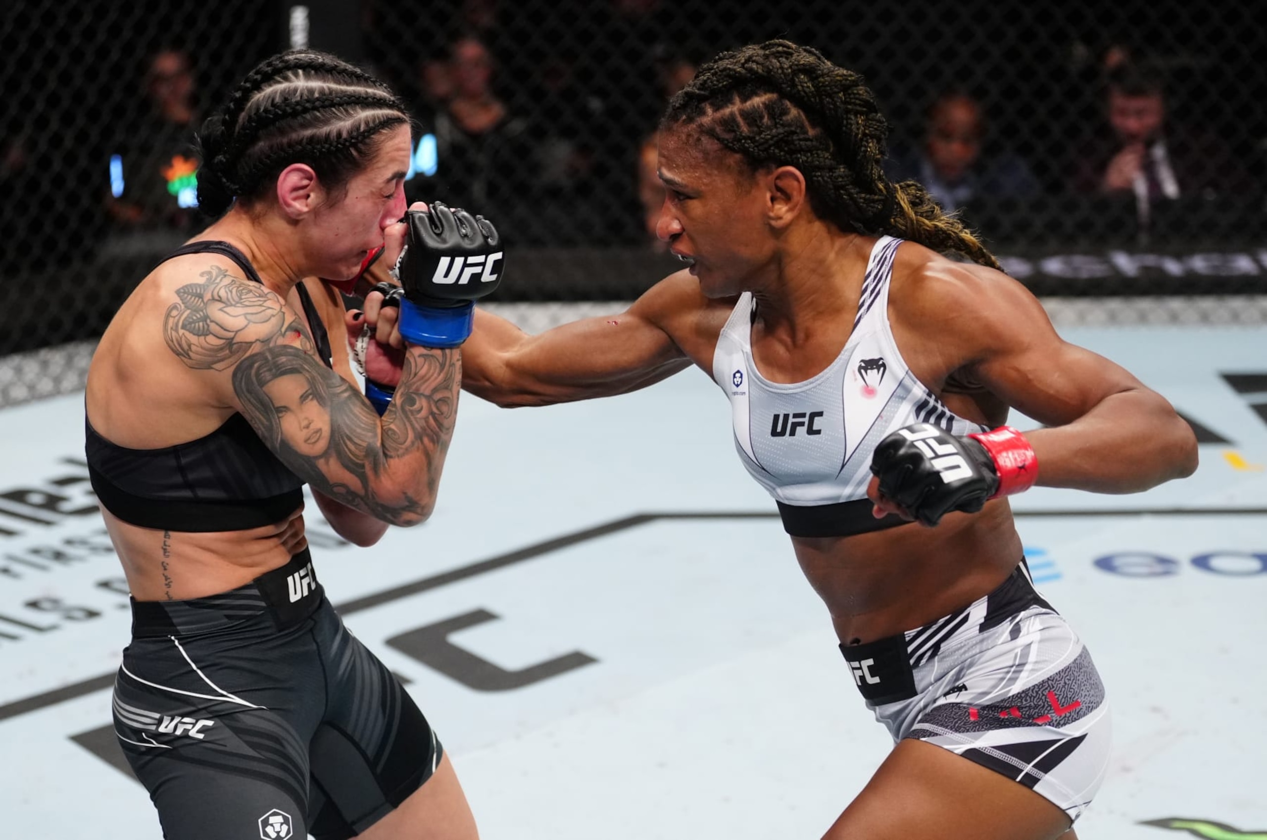 Angela Hill connects on a punch with Emily Ducote in her last bout. 