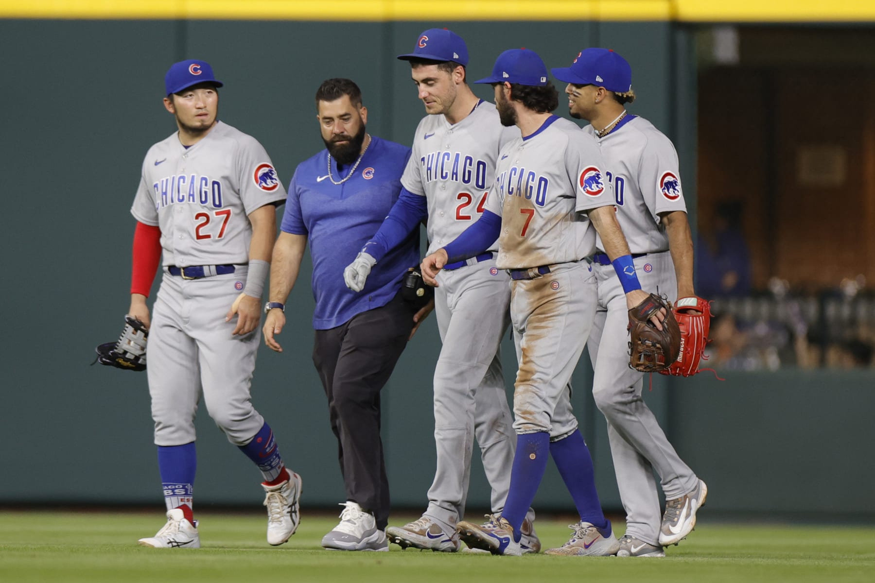 Cody Bellinger (third from left) after being injured on a catch Monday