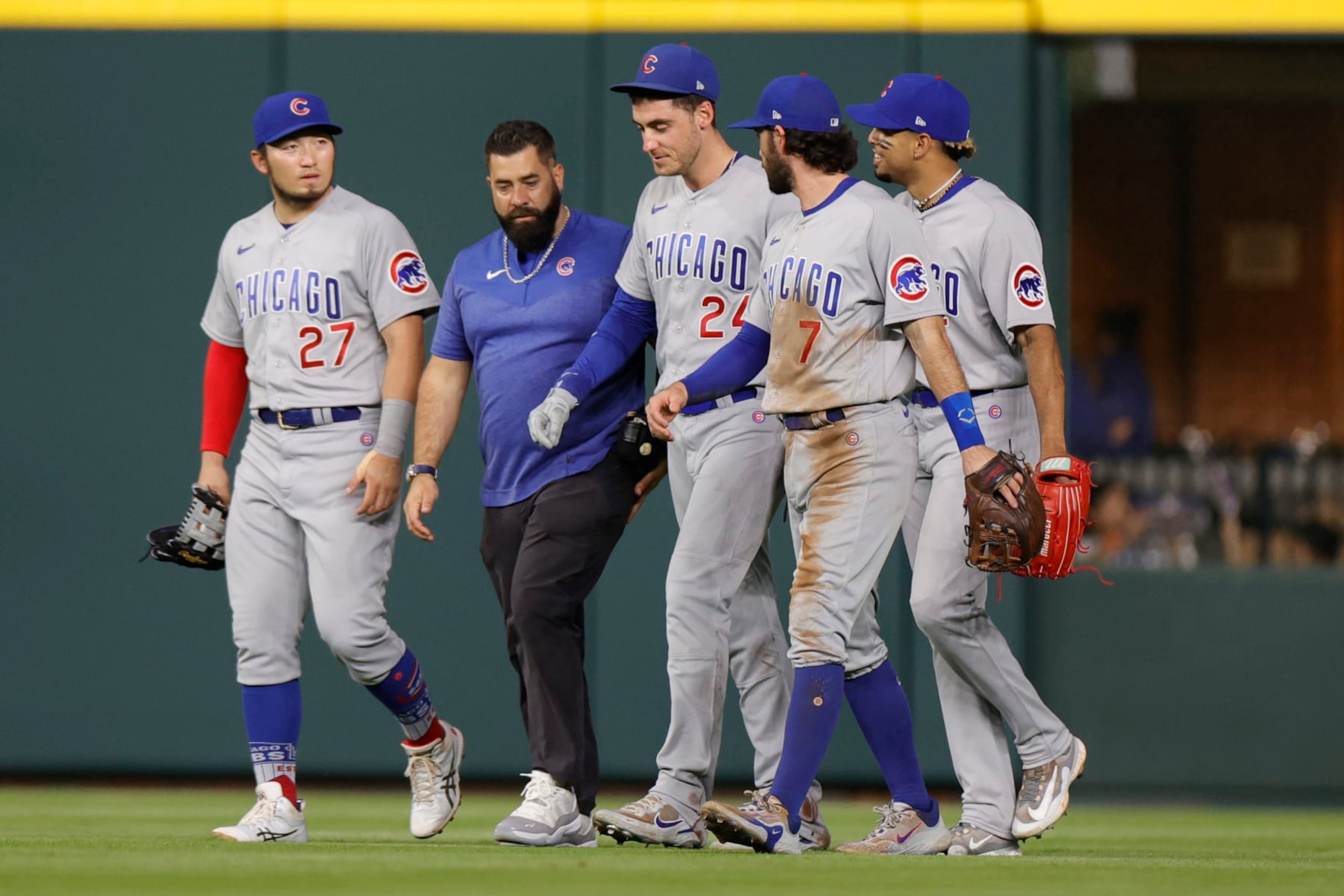 Cody Bellinger (third from left) after being injured on a catch Monday