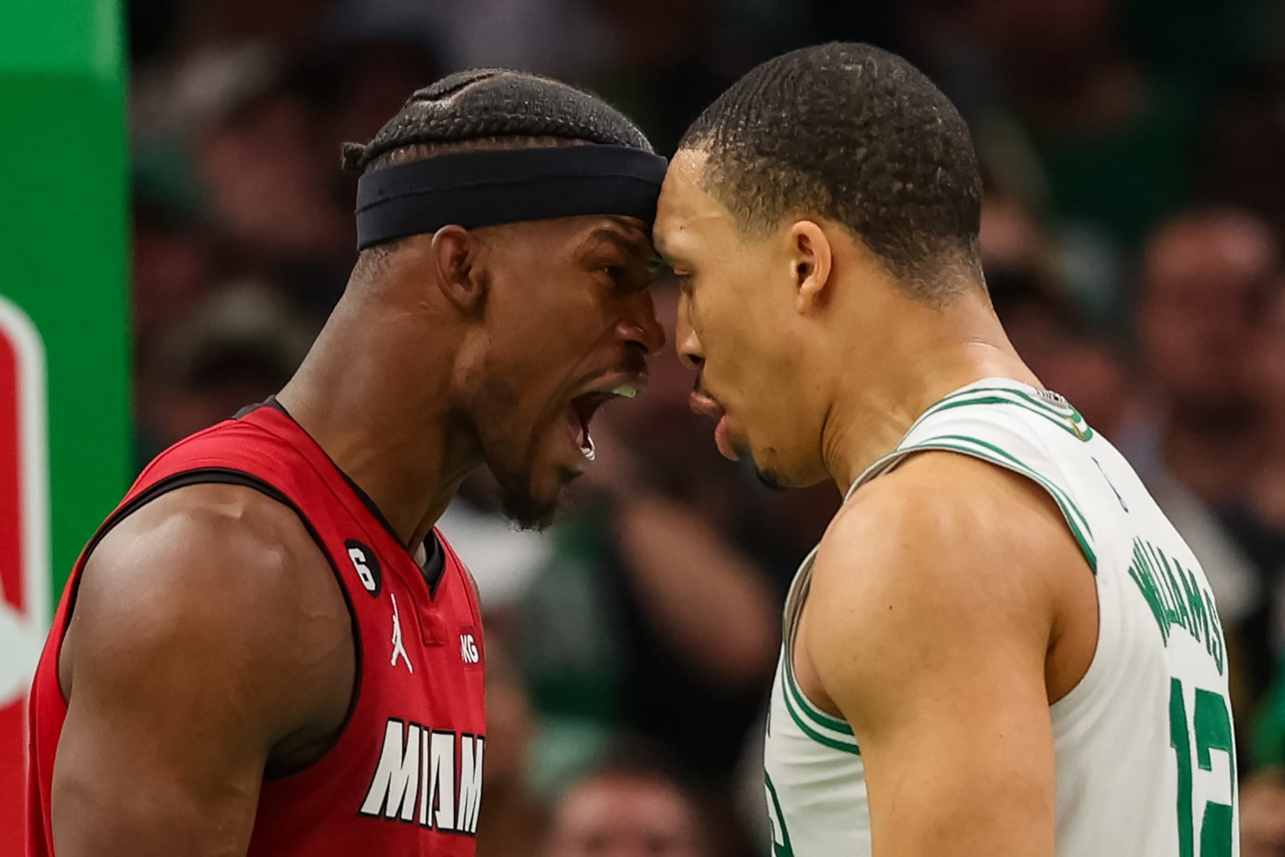 BOSTON, MASSACHUSETTS - MAY 19: Jimmy Butler #22 of the Miami Heat exchanges words with Grant Williams #12 of the Boston Celtics during the fourth quarter in game two of the Eastern Conference Finals at TD Garden on May 19, 2023 in Boston, Massachusetts. NOTE TO USER: User expressly acknowledges and agrees that, by downloading and or using this photograph, User is consenting to the terms and conditions of the Getty Images License Agreement. (Photo by Adam Glanzman/Getty Images)