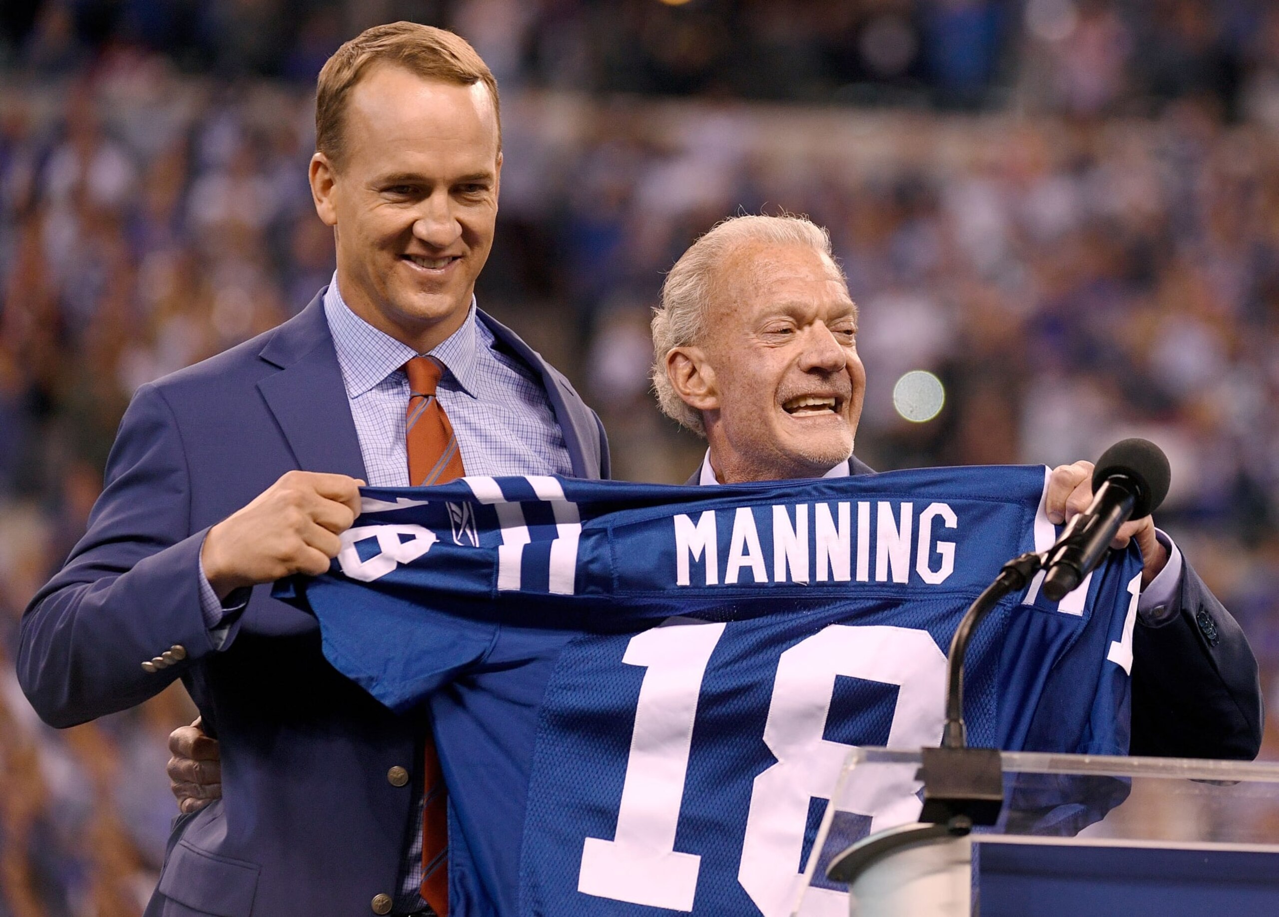 INDIANAPOLIS, IN - OCTOBER 08: Peyton Manning and Jim Irsay, owner of the Indianapolis Colts, pose for photos during a ceremony retiring Manning's jersey during the halftime of the game between the Indianapolis Colts and the San Francisco 49ers at Lucas Oil Stadium on October 8, 2017 in Indianapolis, Indiana.  (Photo by Bobby Ellis/Getty Images)