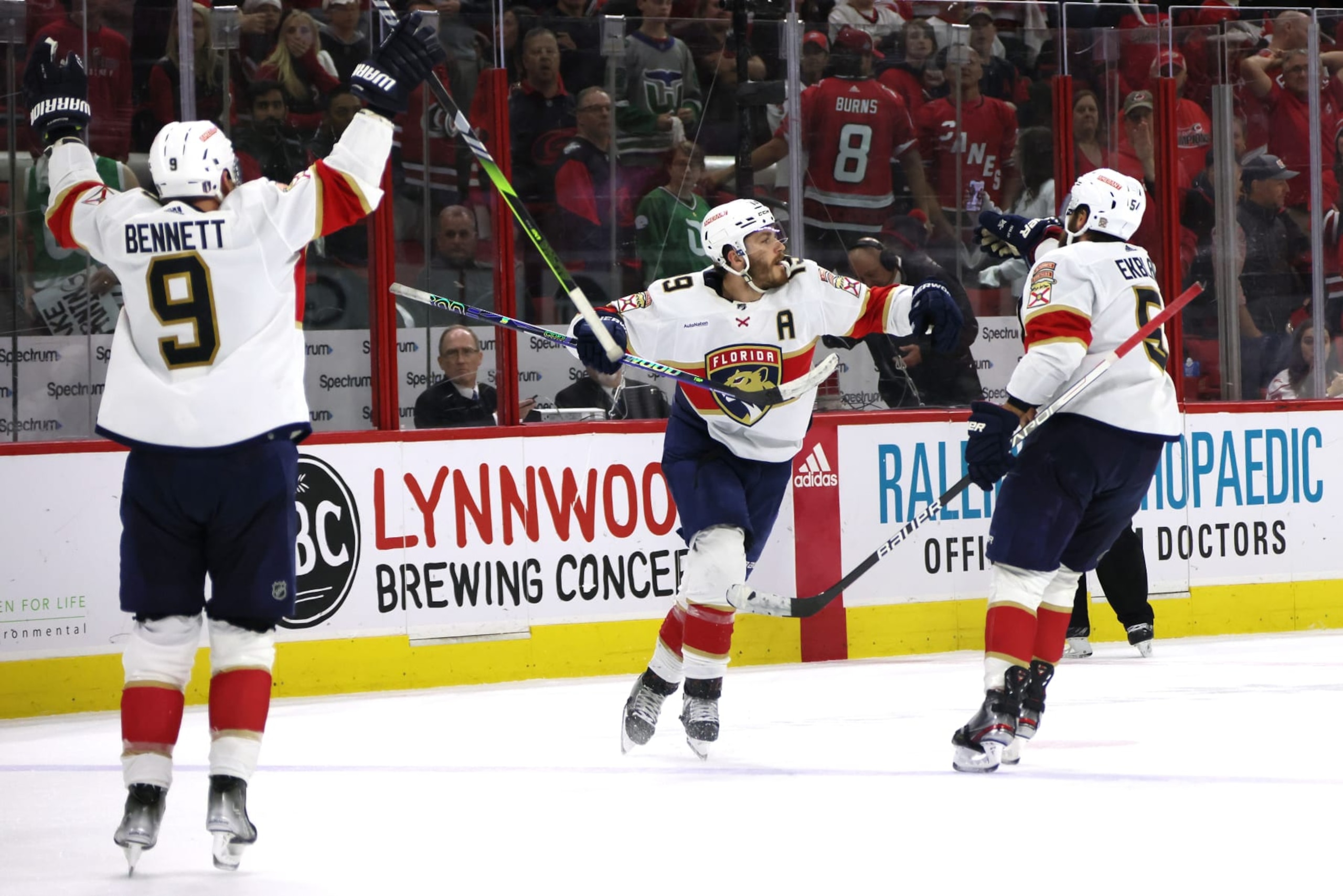 RALEIGH, NORTH CAROLINA - MAY 19: Matthew Tkachuk #19 of the Florida Panthers celebrates with his teammates after scoring the game winning goal on Frederik Andersen #31 of the Carolina Hurricanes in fourth overtime in Game One of the Eastern Conference Final of the 2023 Stanley Cup Playoffs at PNC Arena on May 19, 2023 in Raleigh, North Carolina. (Photo by Bruce Bennett/Getty Images)
