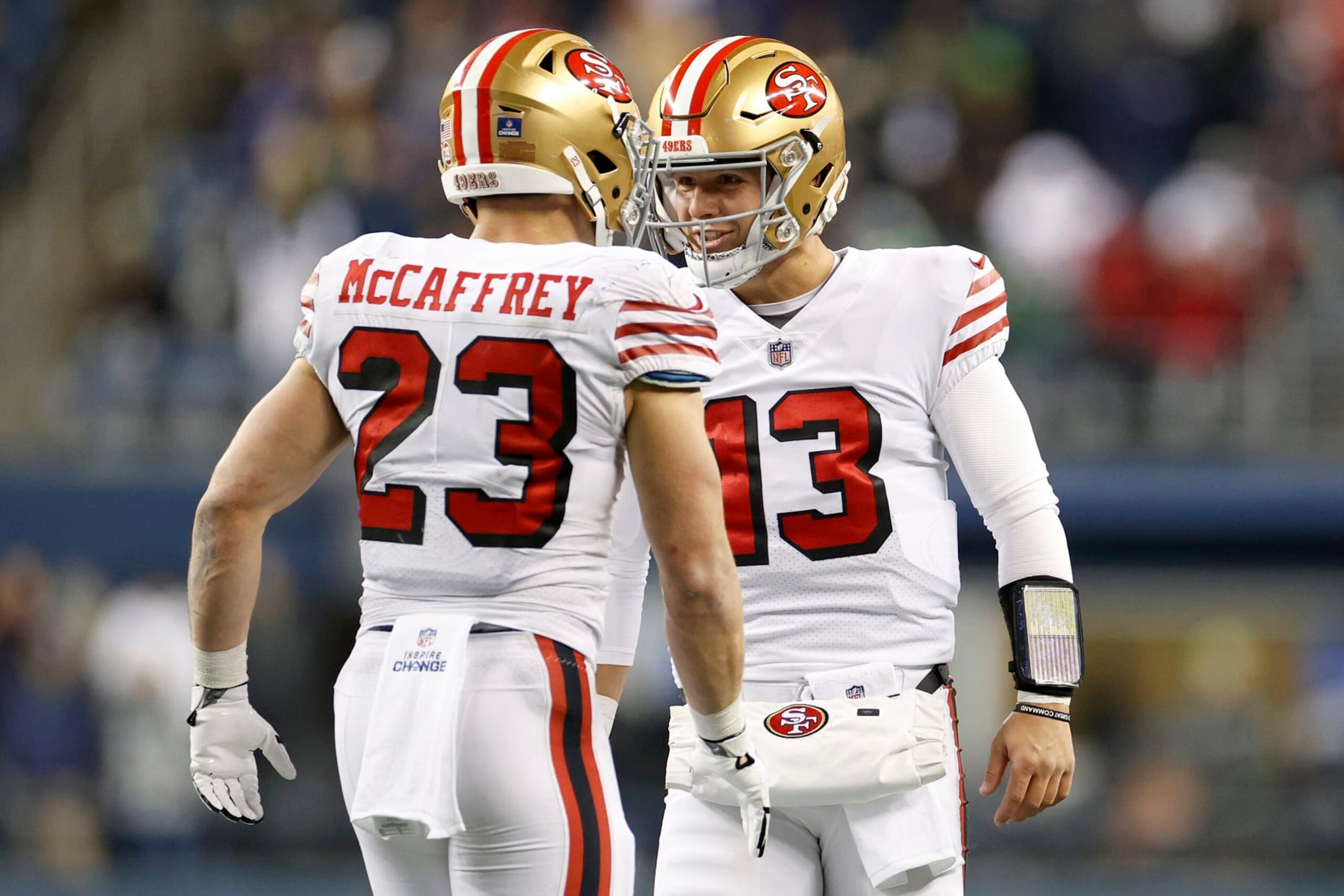 SEATTLE, WASHINGTON - DECEMBER 15: Christian McCaffrey #23 and Brock Purdy #13 of the San Francisco 49ers celebrate a touchdown during the third quarter against the Seattle Seahawks at Lumen Field on December 15, 2022 in Seattle, Washington. (Photo by Steph Chambers/Getty Images) SEATTLE, WASHINGTON - DECEMBER 15: Christian McCaffrey #23 and Brock Purdy #13 of the San Francisco 49ers celebrate a touchdown during the third quarter against the Seattle Seahawks at Lumen Field on December 15, 2022 in Seattle, Washington. (Photo by Steph Chambers/Getty Images)