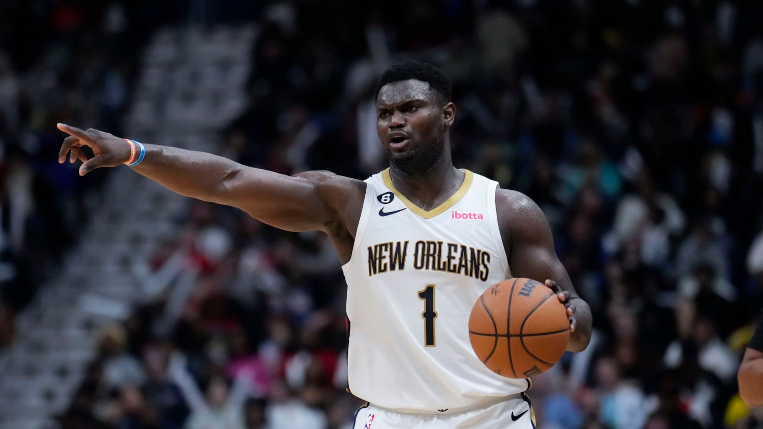 New Orleans Pelicans forward Zion Williamson (1) moves the ball down court in the second half of an NBA basketball game against the Milwaukee Bucks in New Orleans, Monday, Dec. 19, 2022. The Bucks won 128-119. (AP Photo/Gerald Herbert)