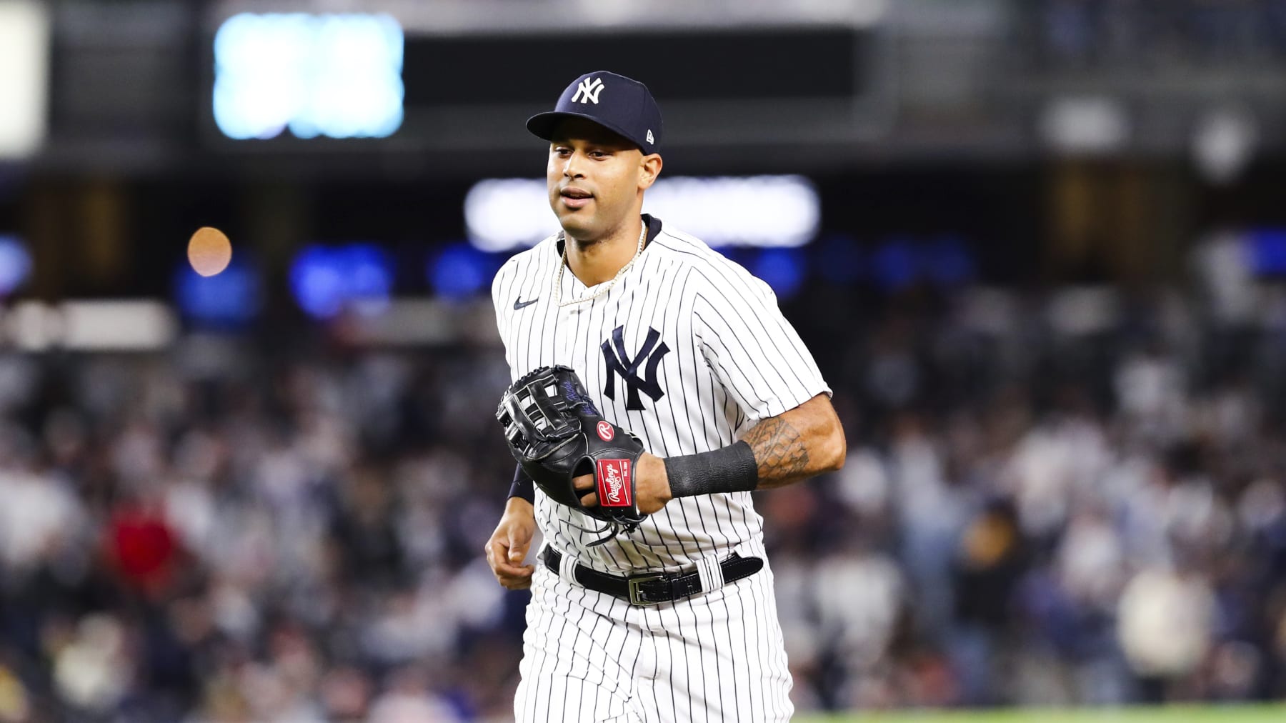 New York Yankees left fielder Aaron Hicks runs towards the dugout after making a catch against Boston Red Sox designated hitter J.D. Martinez during the first inning of a baseball game Sunday, Sept. 25, 2022, in New York. (AP Photo/Jessie Alcheh)