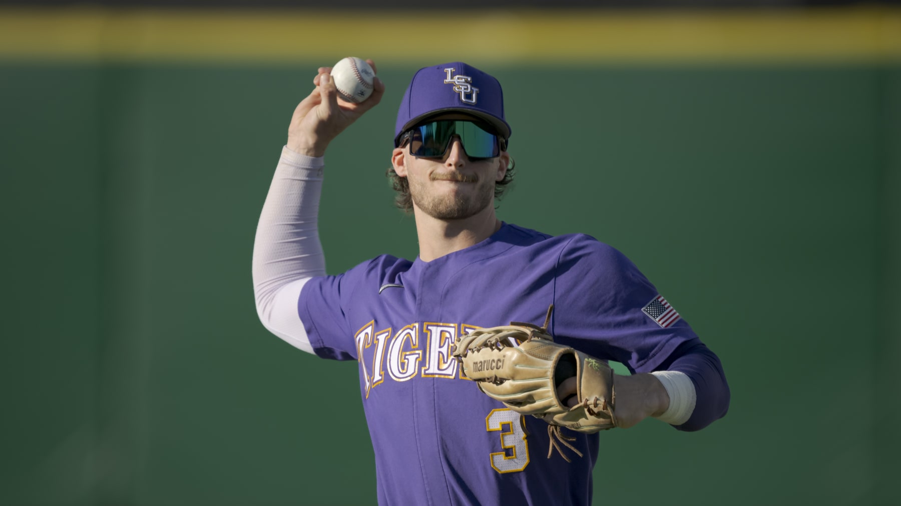 LSU outfielder Dylan Crews (3) throws during an NCAA baseball game on Tuesday, March 21, 2023, in Baton Rouge, La. (AP Photo/Matthew Hinton)
